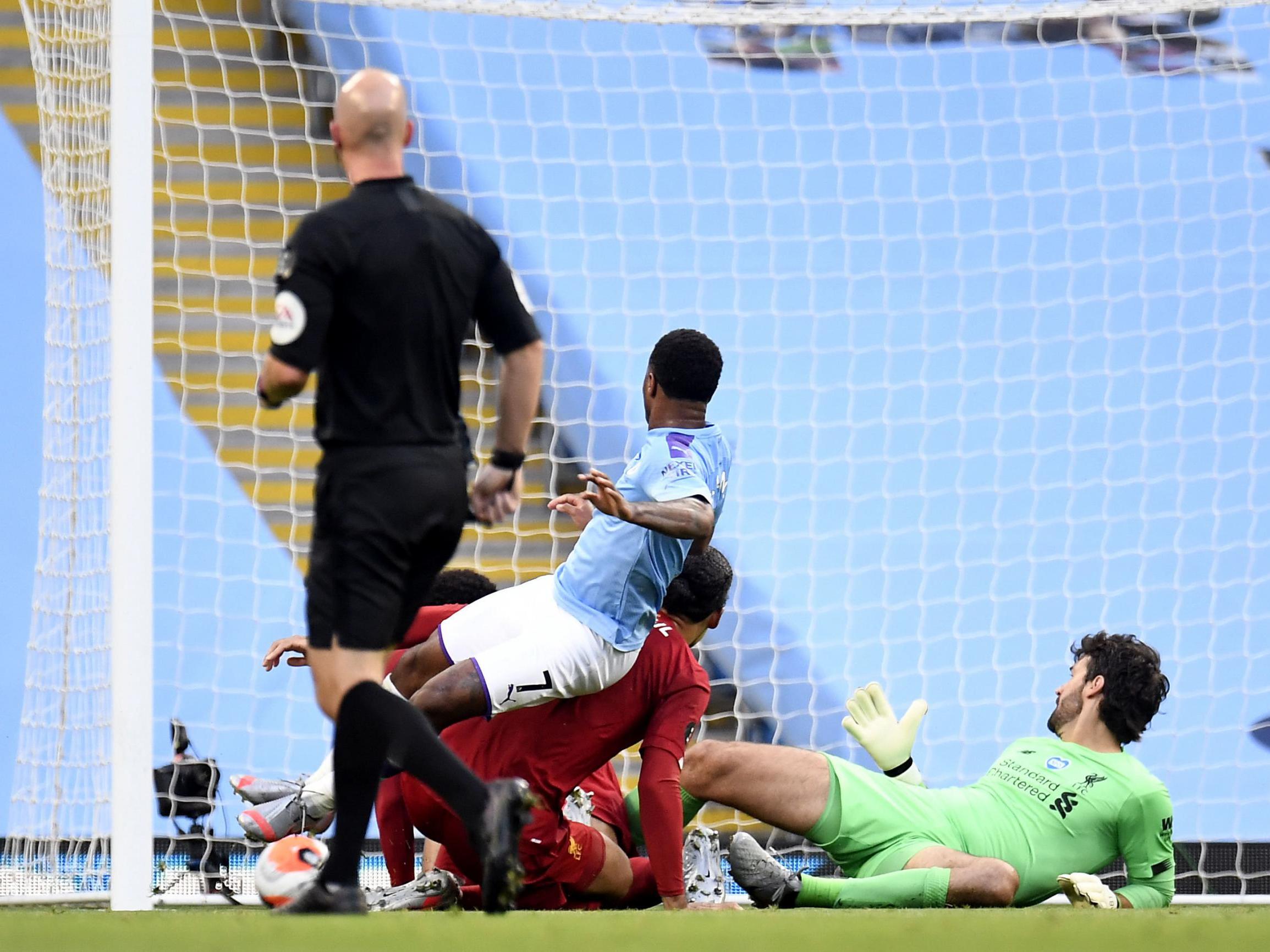Manchester City’s Raheem Sterling scores his side’s second goal