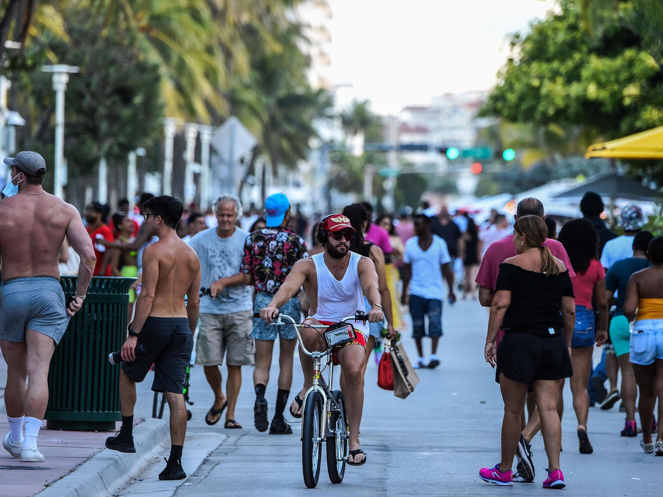 No masks on Ocean Drive in Miami Beach, where the number of cases is soaring (AFP/Getty)