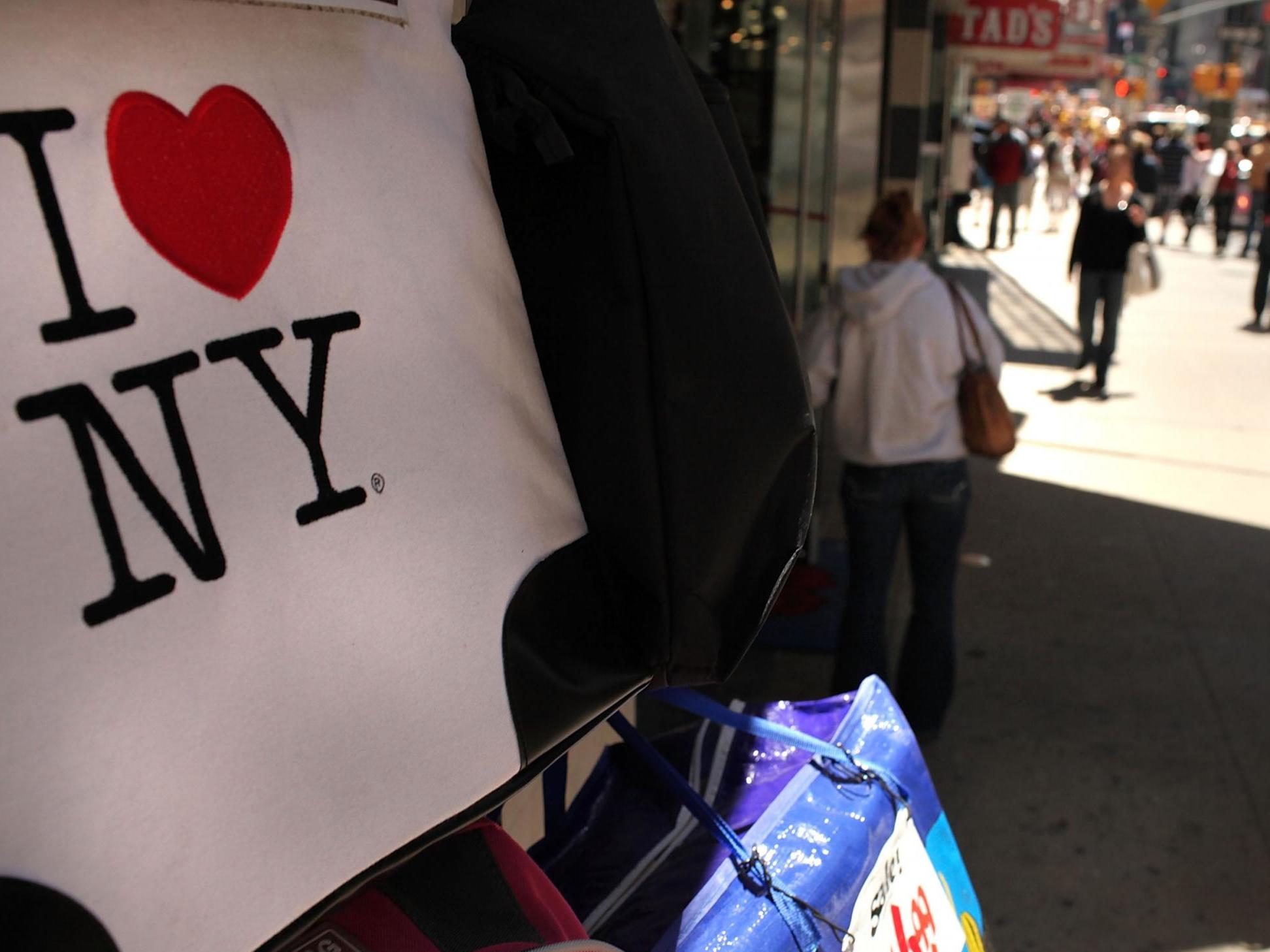 An ‘I love New York’ logo is displayed in Times Square