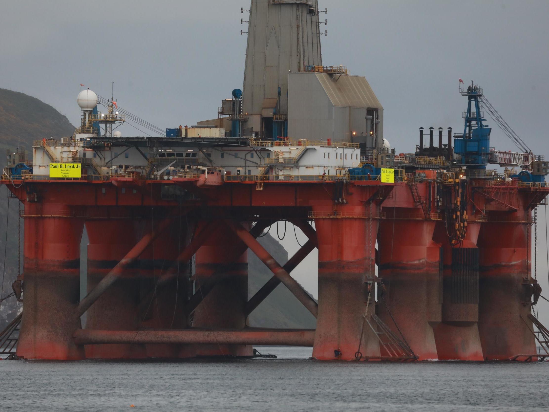 Greenpeace climbers on the oil rig in Cromarty Firth, Scotland as it was being towed out to sea