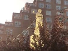 Christopher Columbus statue toppled and thrown into water