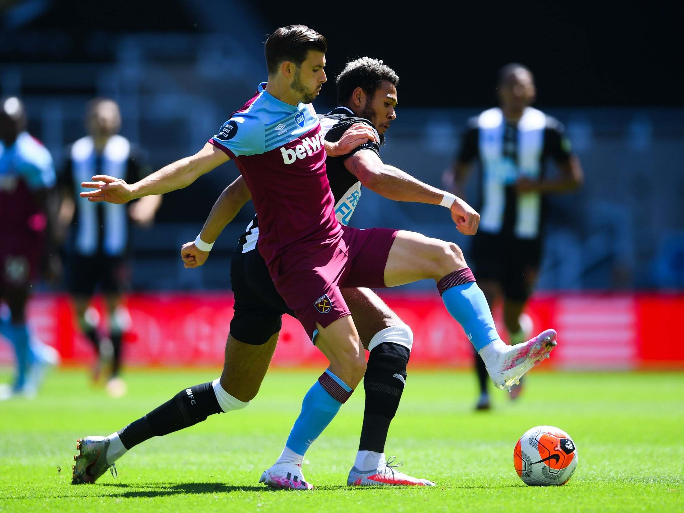 West Ham’s Aaron Cresswell battles for the ball
