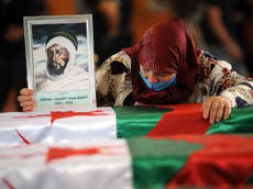 Algeria buries two dozen resistance fighters after skulls returned 