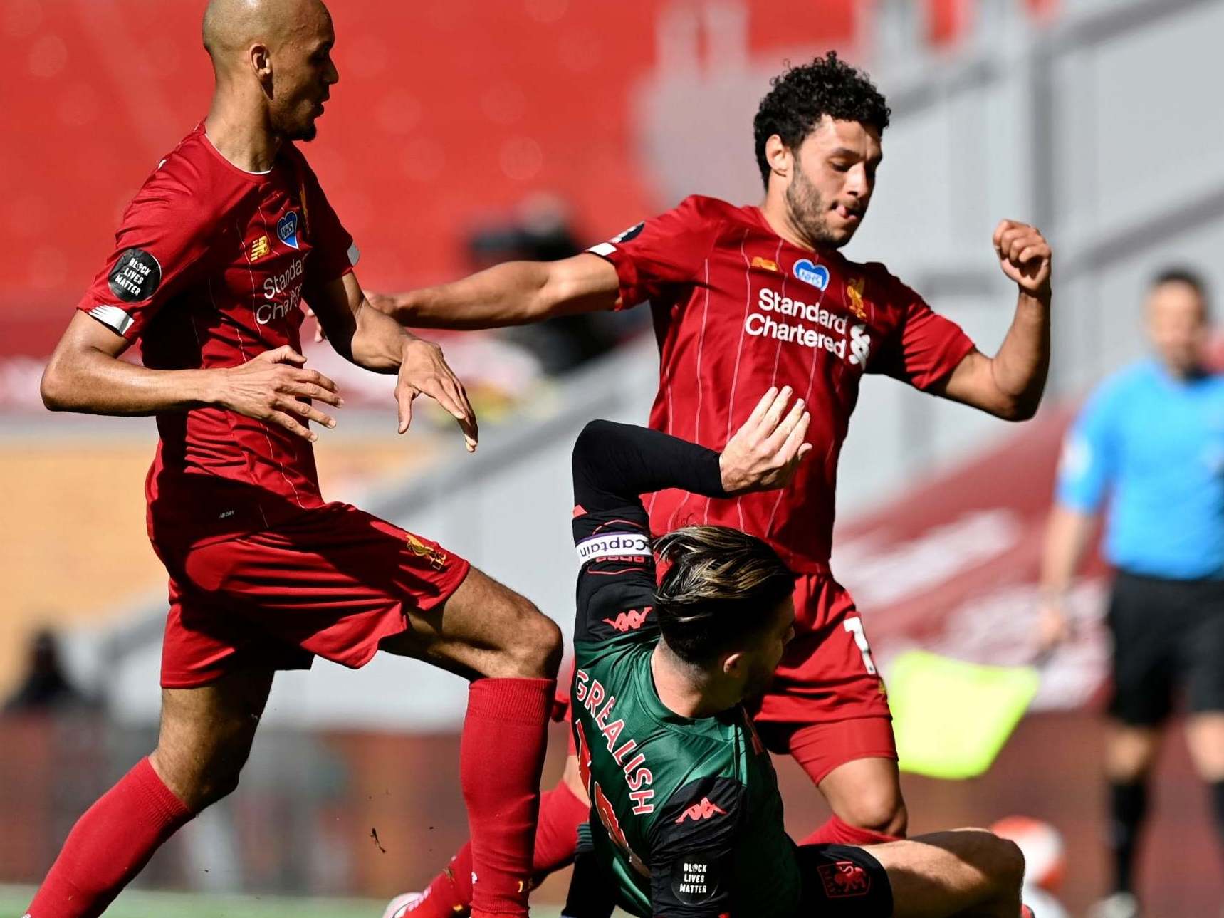 Aston Villa’s Jack Grealish challenges Liverpool’s Fabinho (left) and Alex Oxlade-Chamberlain