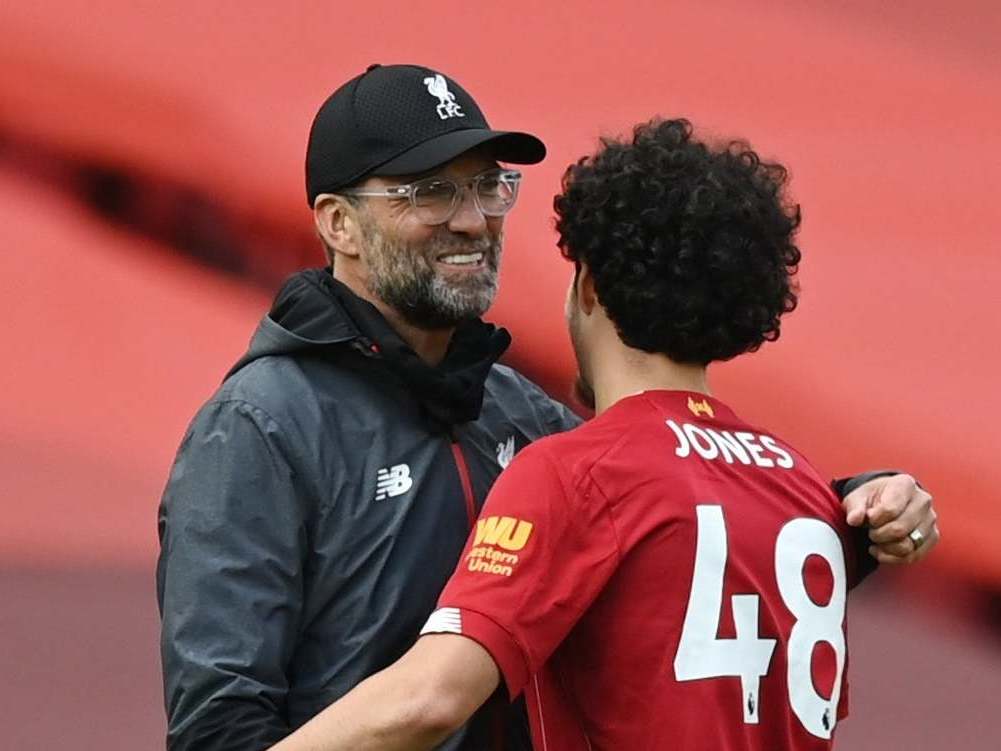 Curtis Jones celebrates with Jurgen Klopp