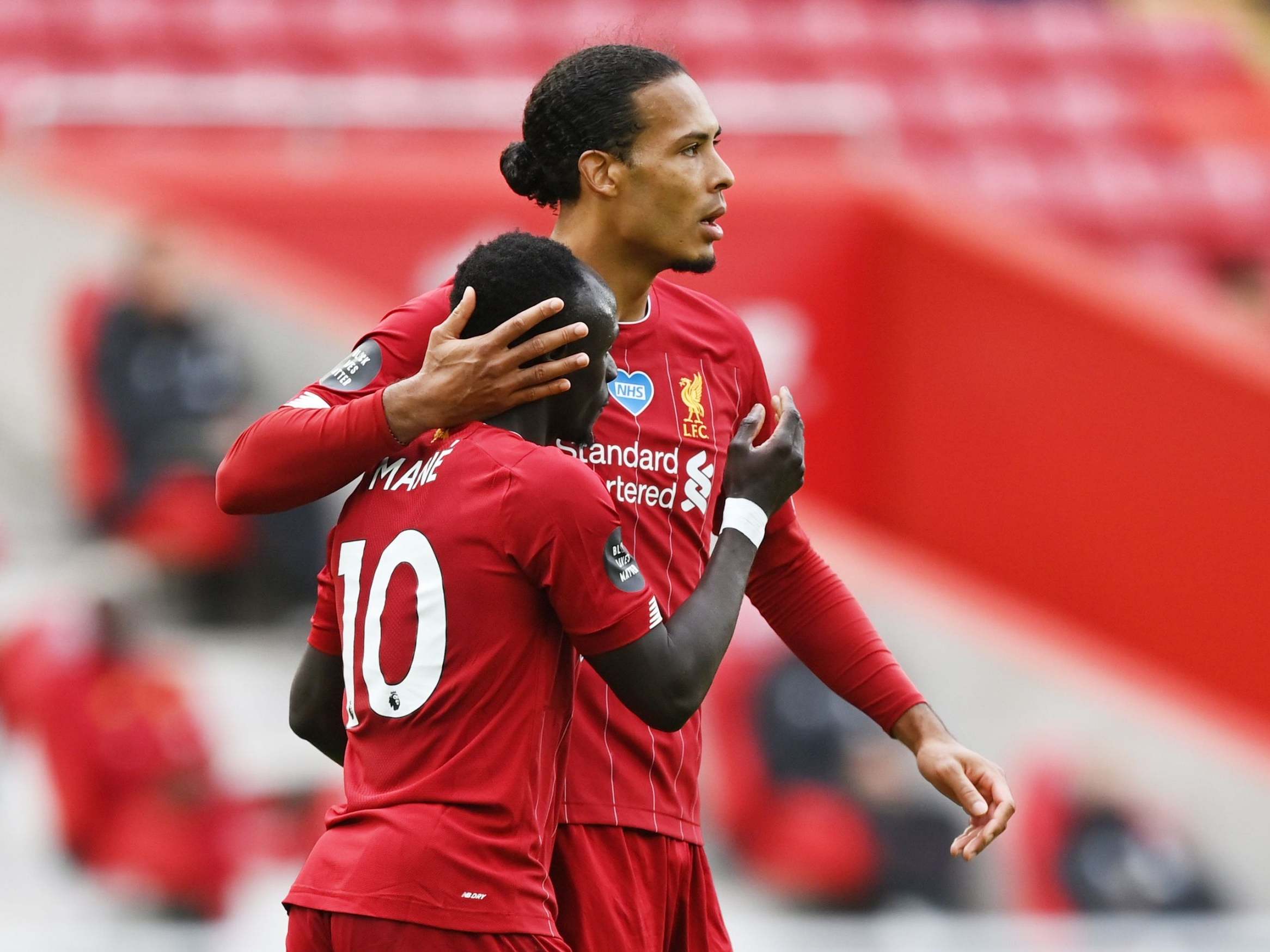 Sadio Mane celebrates with Virgil van Dijk (Reuters)