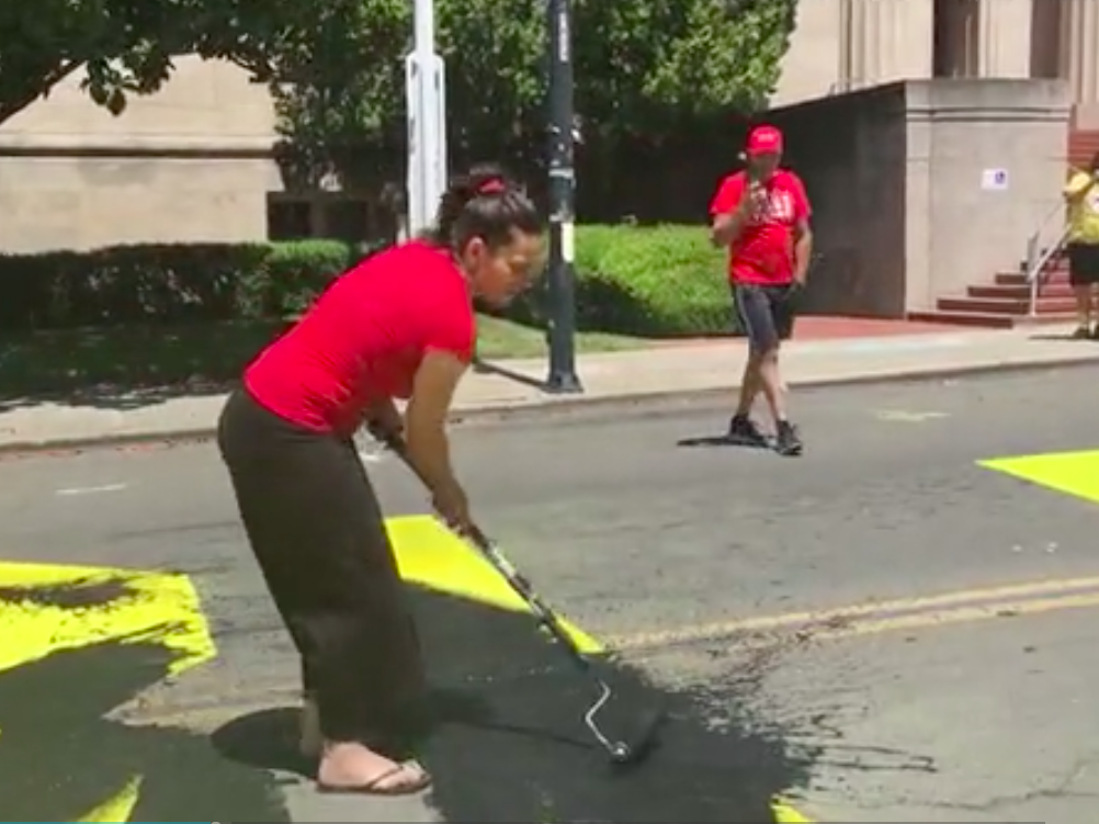 Two charged with hate crime after Black Lives Matter mural vandalised