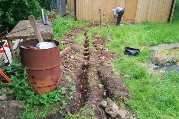 Volunteers work on a fibre ducting trench in Caton, Lancashire