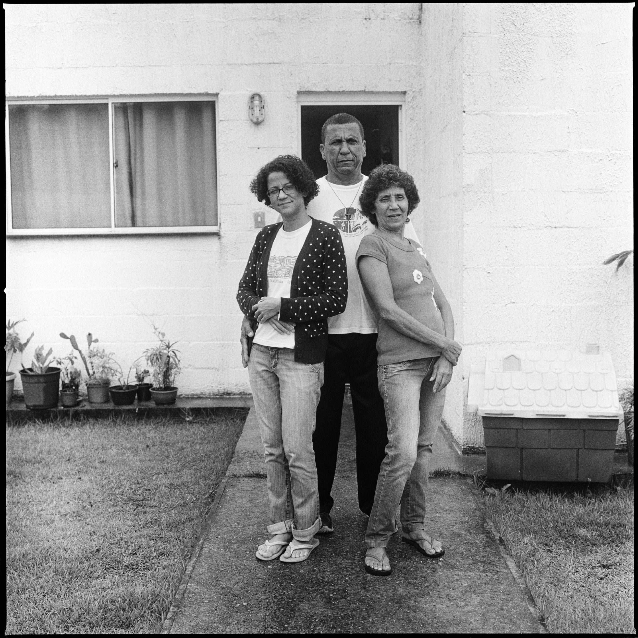 Nathalia Silva, left, with parents Luiz Claudio Silva and Maria da Penha Macena at their home in Vila Autódromo