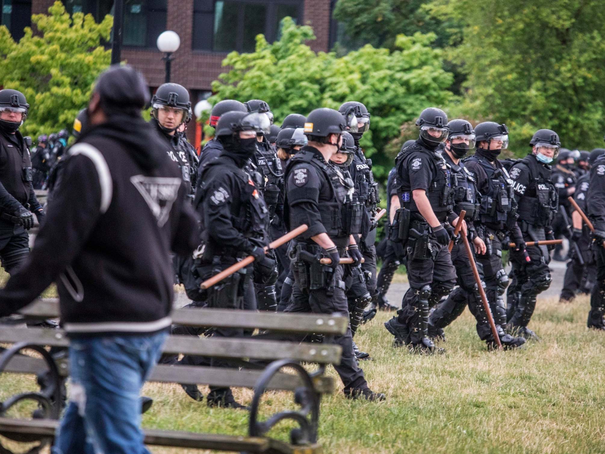 Officers armed with sticks clear Seattle’s Cal Anderson Park