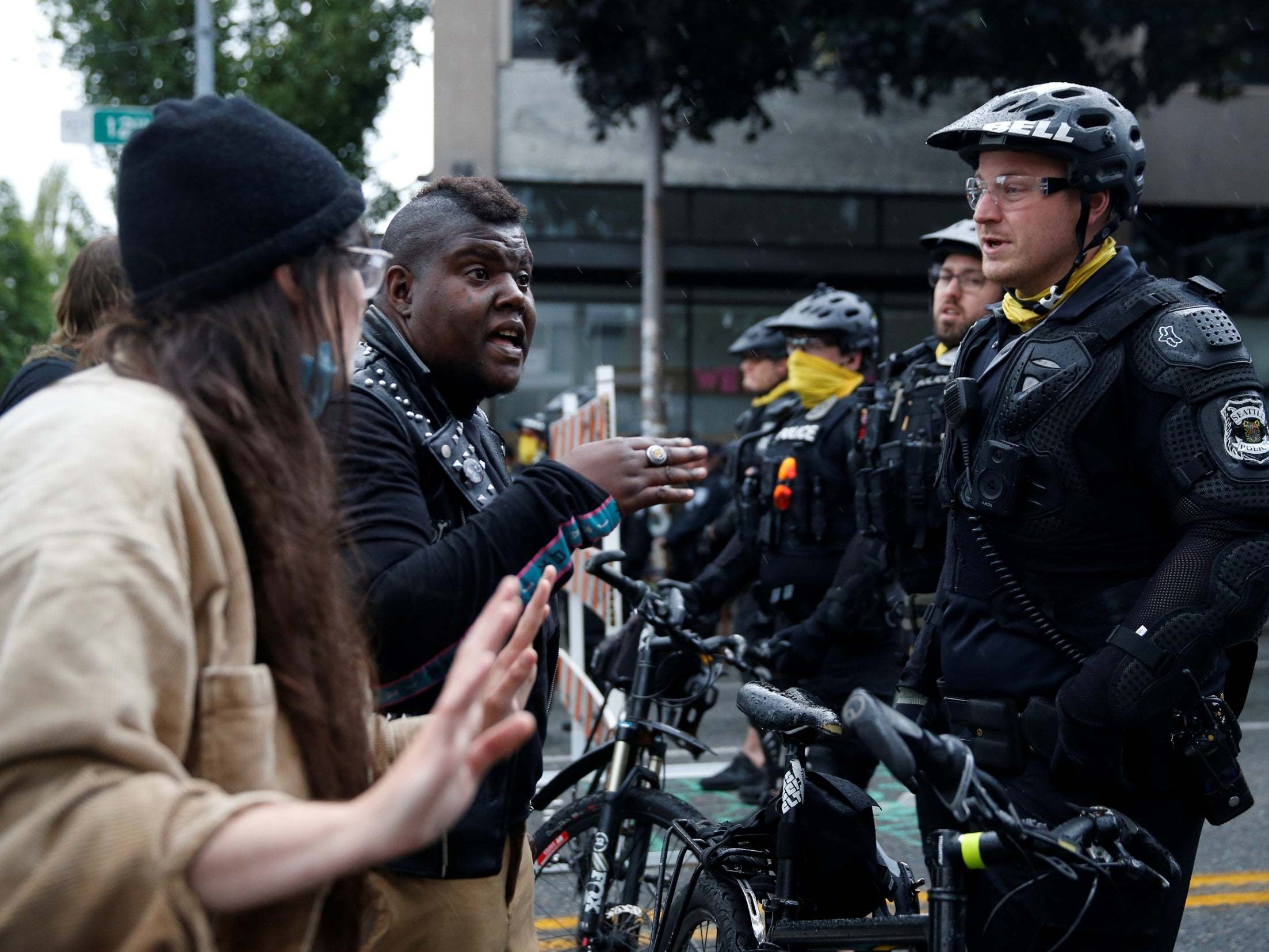 Protesters talk to Seattle police officers (Reuters)