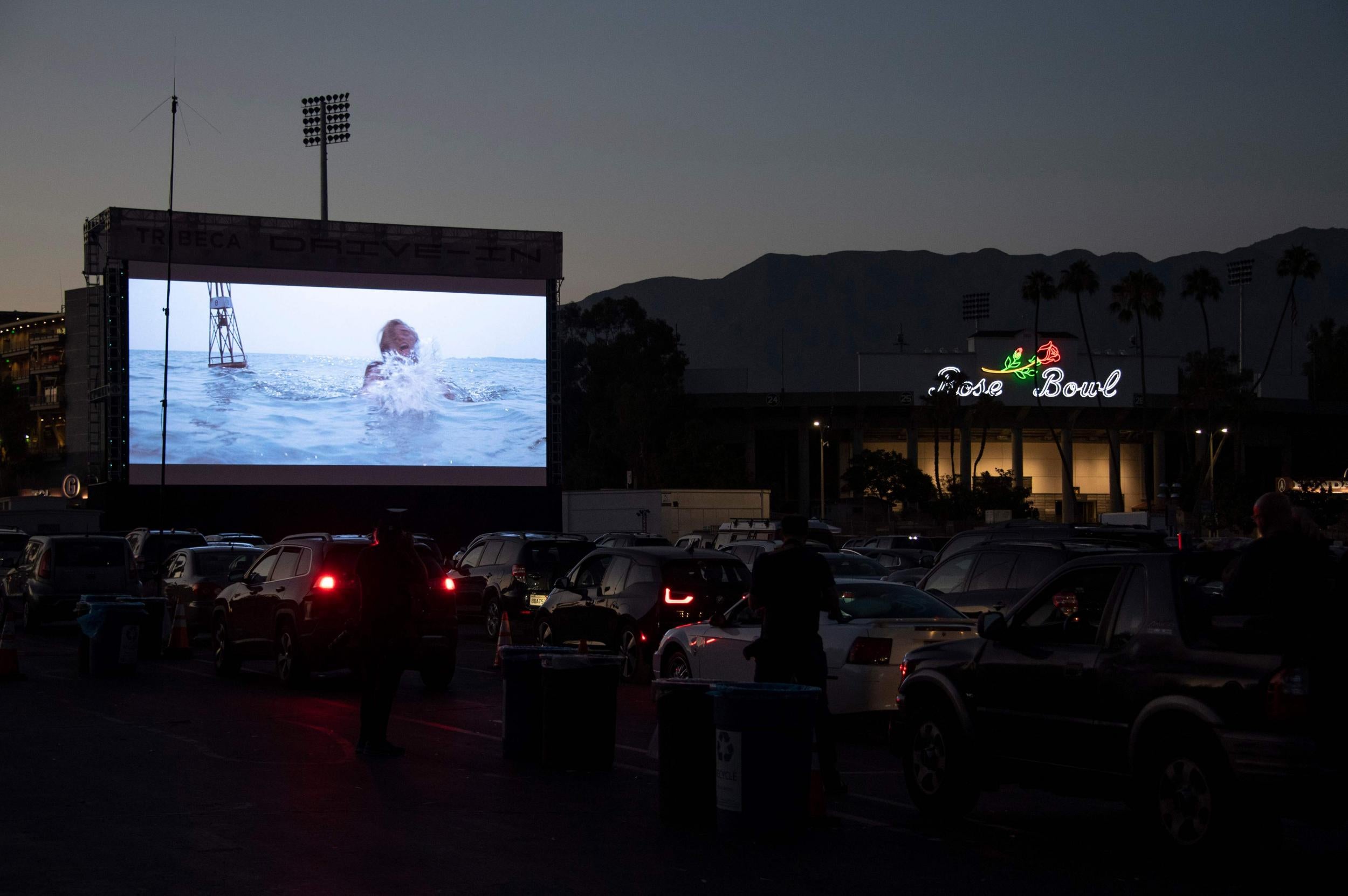 People watch Jaws as part of the Tribeca Film Festival's drive-in movie series at the Rose Bowl in Pasadena, California, on July 2, 2020