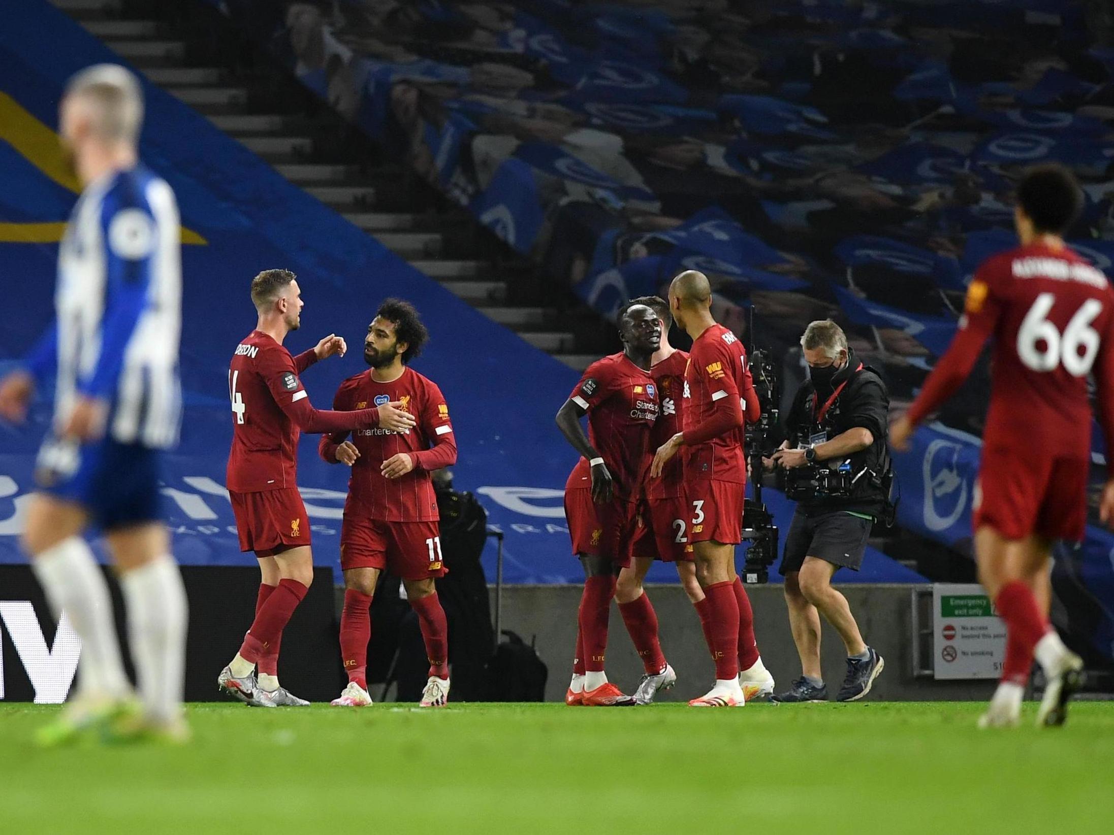 Liverpool celebrate Mohamed Salah’s second and their third of the evening. (Getty Images)