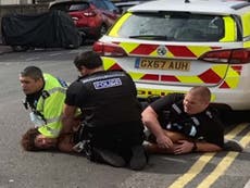 Sussex Police officers pin man on road as he shouts ‘I can’t breathe’