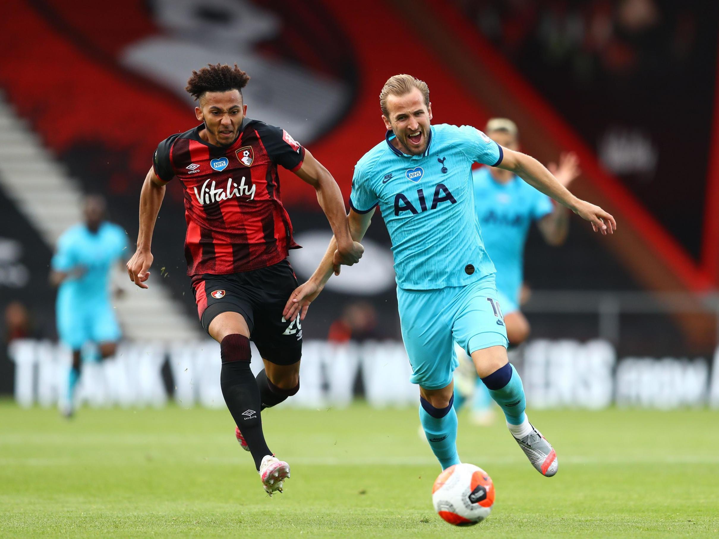 Kane and Kelly challenge for the ball