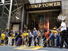 New York mayor Bill de Blasio helps paint Black Lives Matter mural in front of Trump Tower