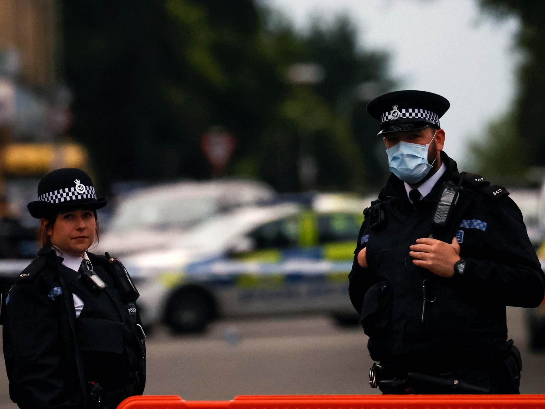 Police officers at the scene where a woman was shot by officers in Toxteth, Liverpool, 9 July 2020.