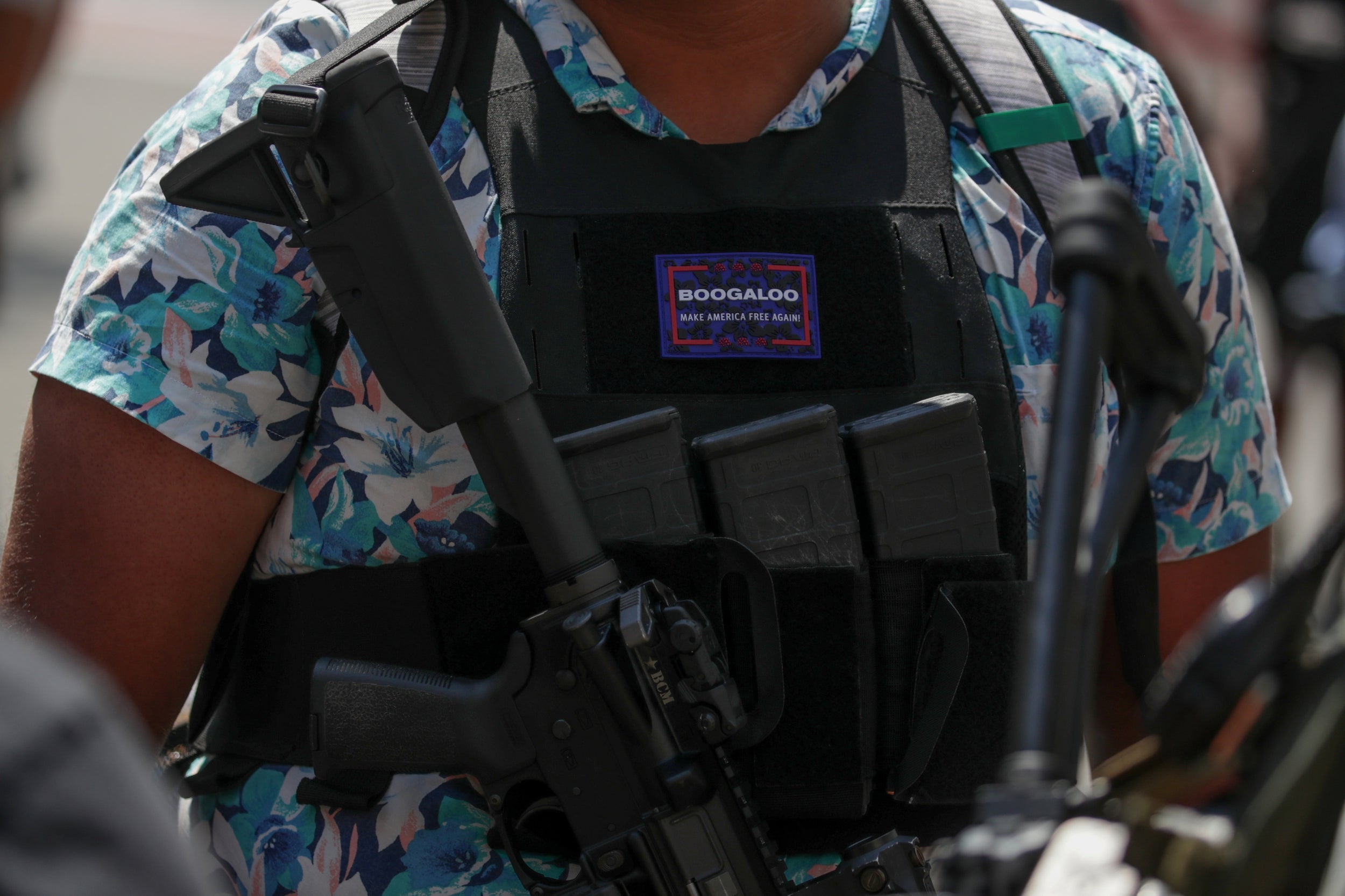 A protester wearing a Boogaloo badge at a rally for Second Amendment gun rights in Richmond, Virginia