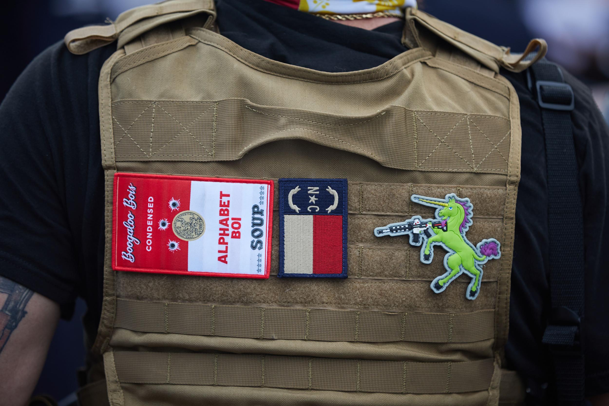 A Boogaloo Boi at a march in North Carolina. ‘Alphabet’ is a reference to US federal agencies that use acronyms, such as the FBI (AFP)