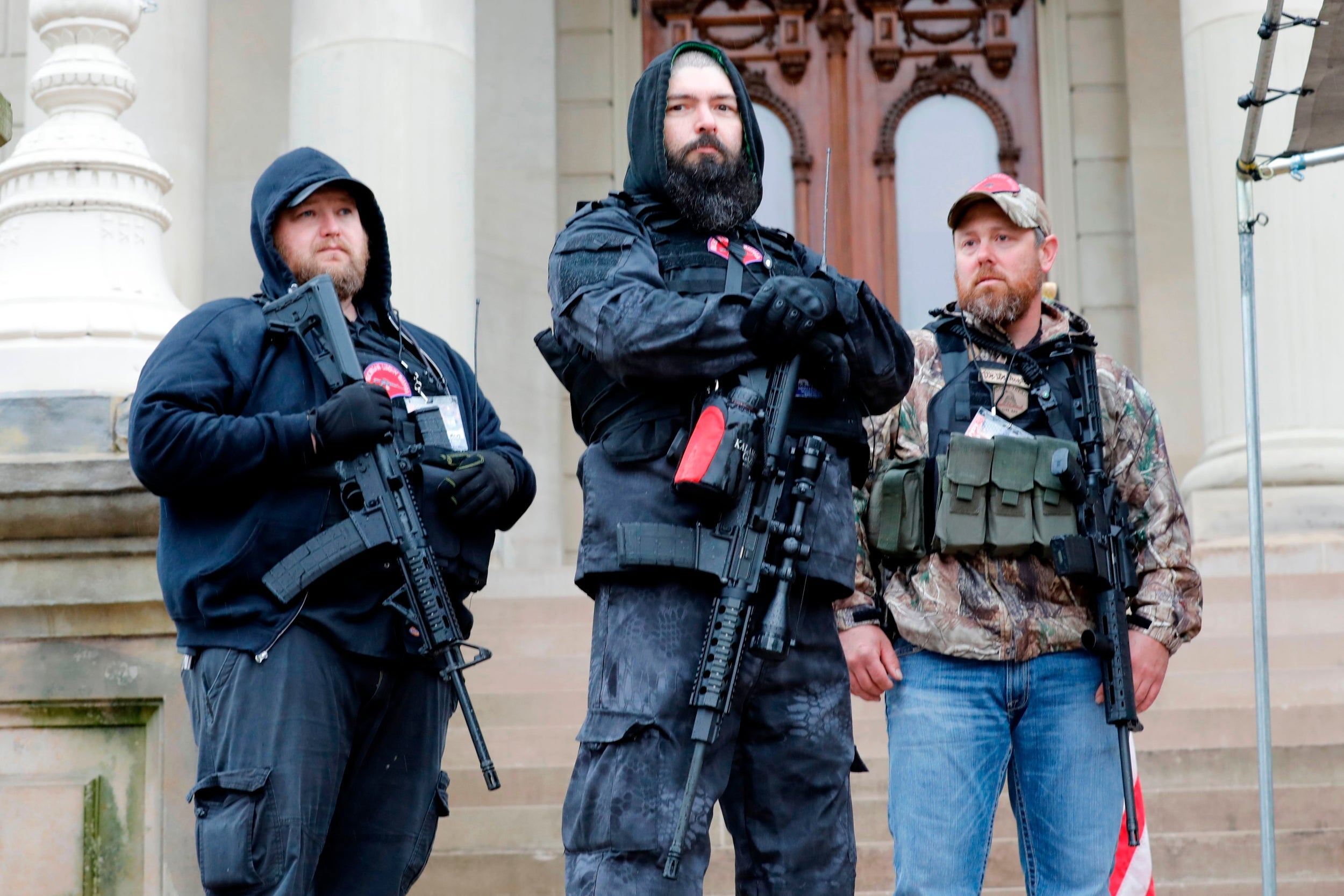 Demonstrators on the steps of the Michigan State Capitol in Lansing, demanding the reopening of businesses during lockdown (AFP)