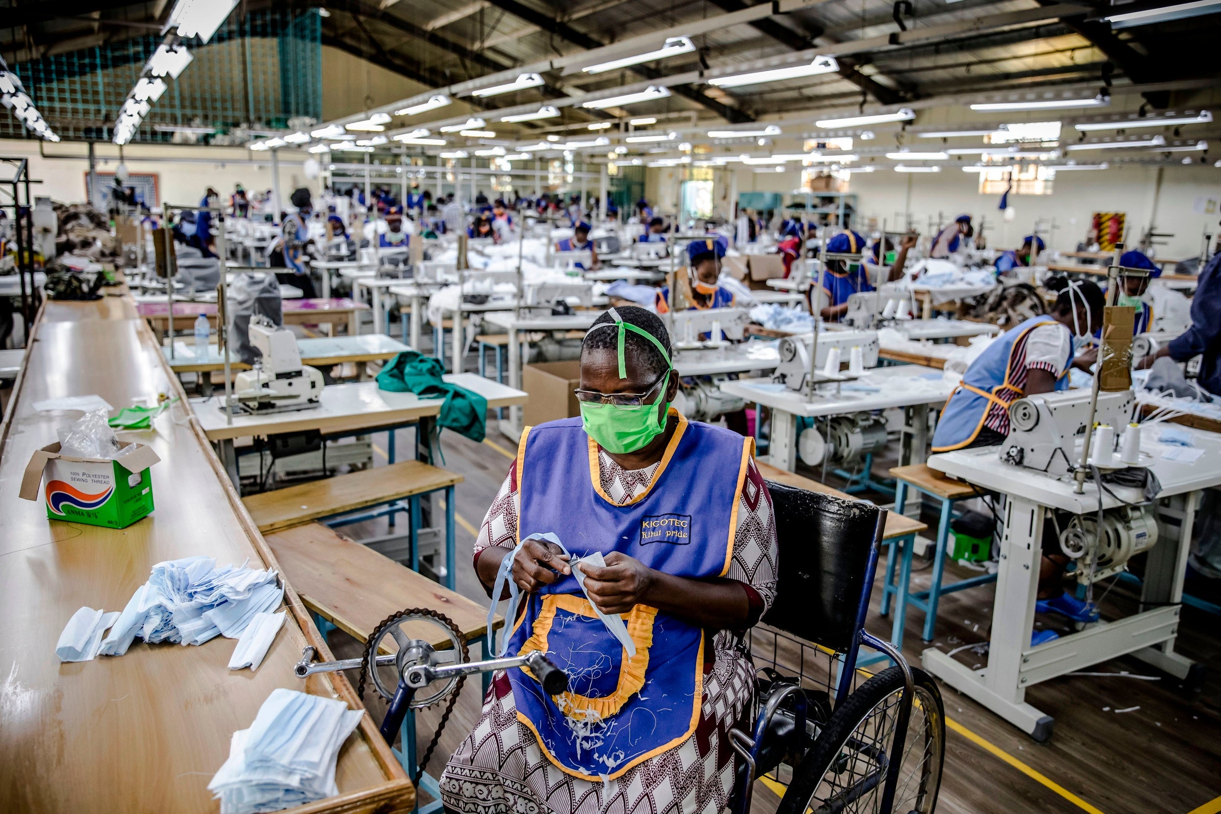 A worker produces face masks at a garment factory in Kitui, Kenya