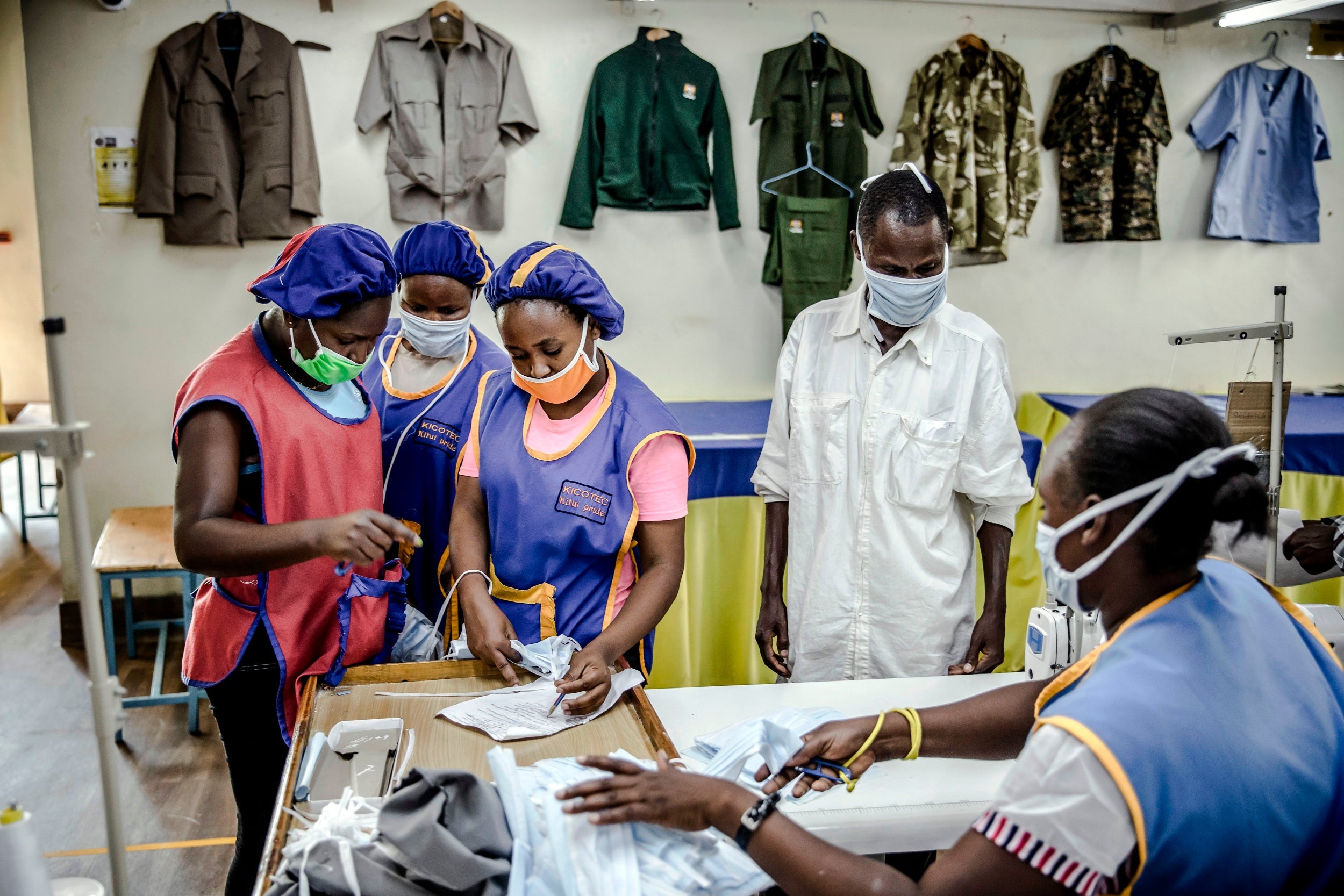 Reviewing the day’s production of face masks at the Kicotec factory in Kitui