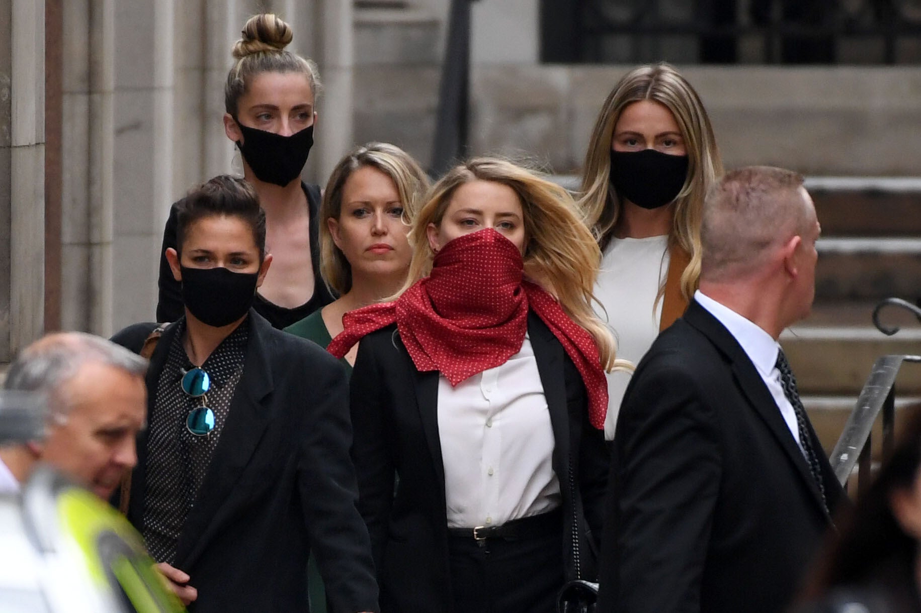 Amber Heart seen wearing a red bandana on her way to the High Court in London.