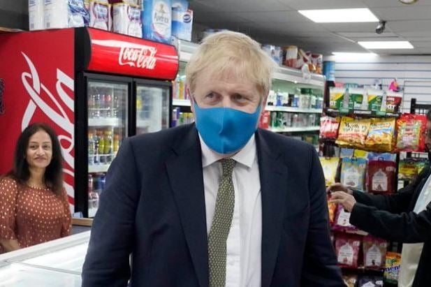 Boris Johnson was first pictured wearing a mask only last week