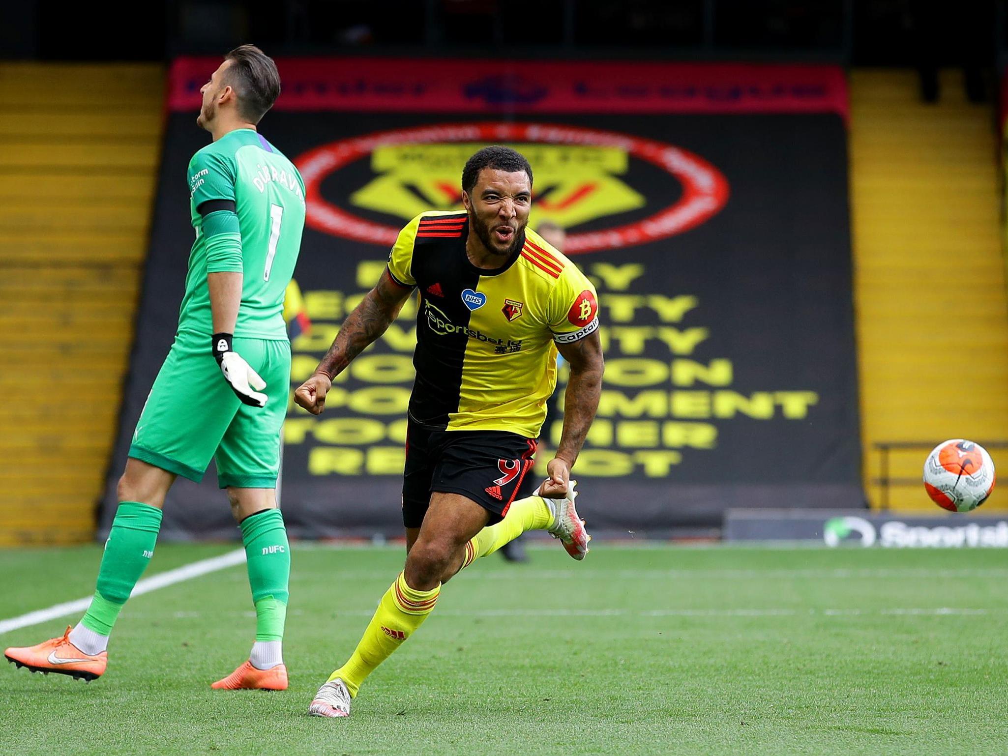 Troy Deeney celebrates after scoring from the penalty spot