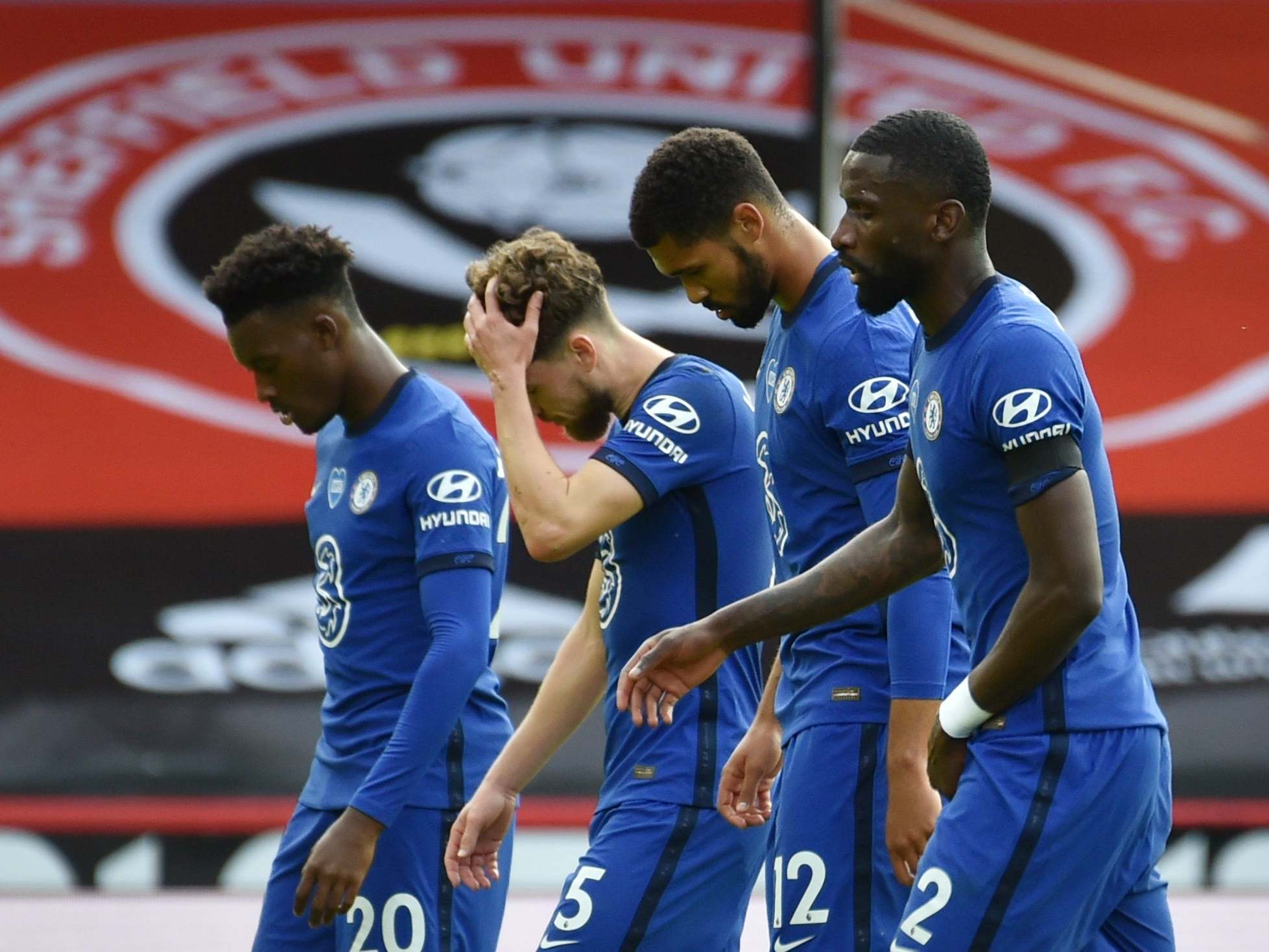 Chelsea players react at full-time after their defeat by Sheffield United