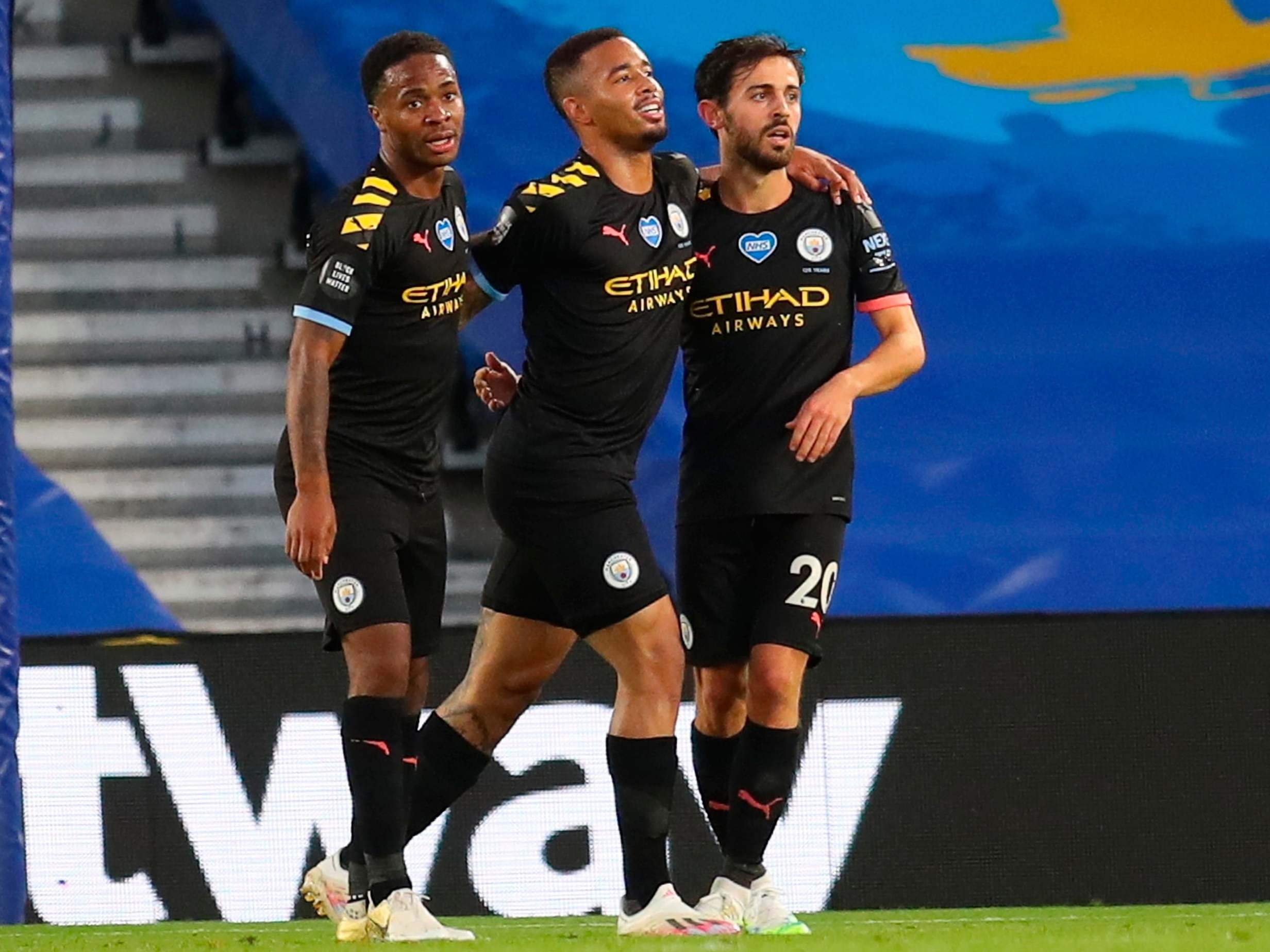 City celebrate after Bernardo Silva, right, adds a fourth goal