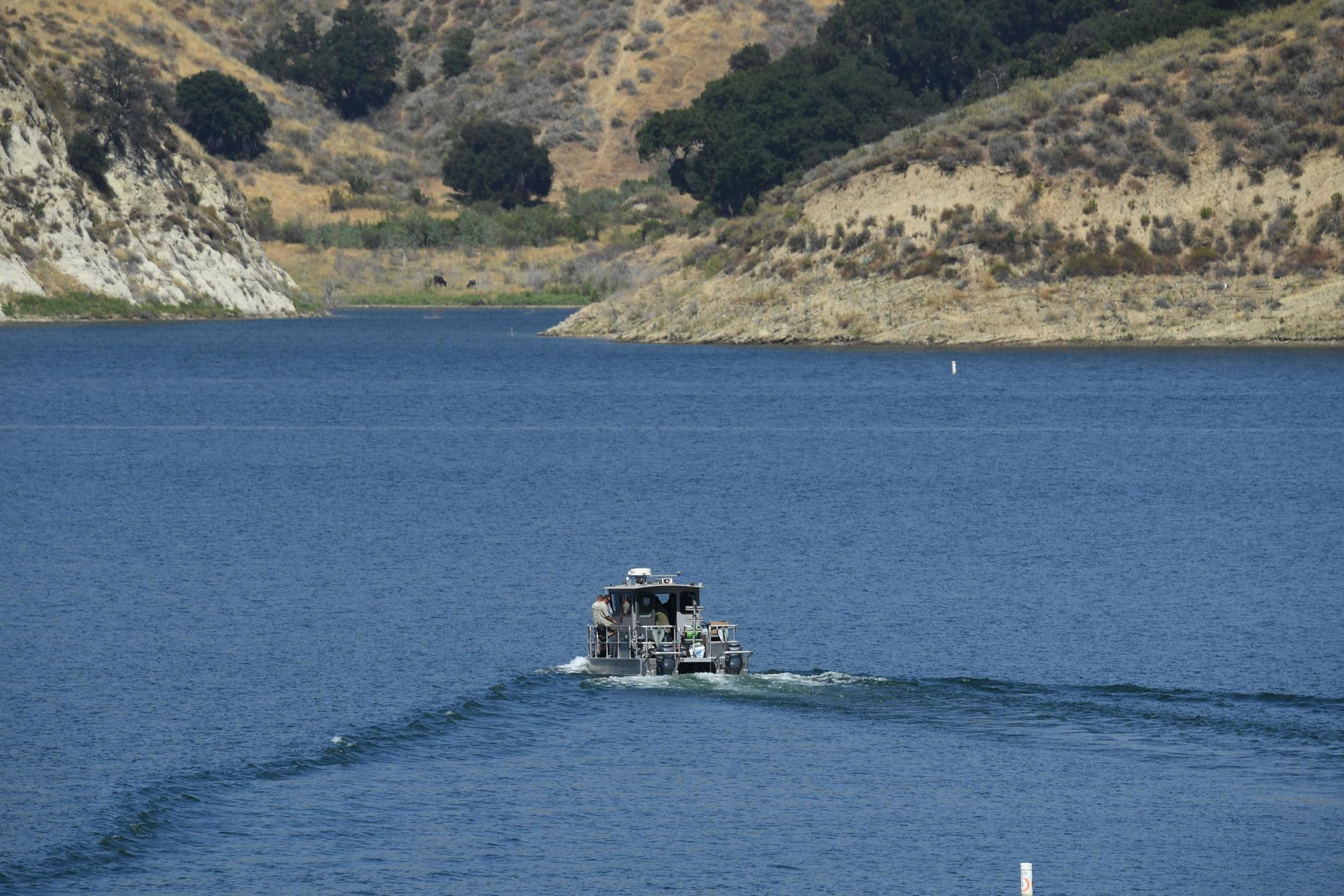 A Los Angeles County Sheriff’s Department boat is seen on Lake Piru, California, as it aids in the effort to find actor Naya Rivera on 10 July 2020.