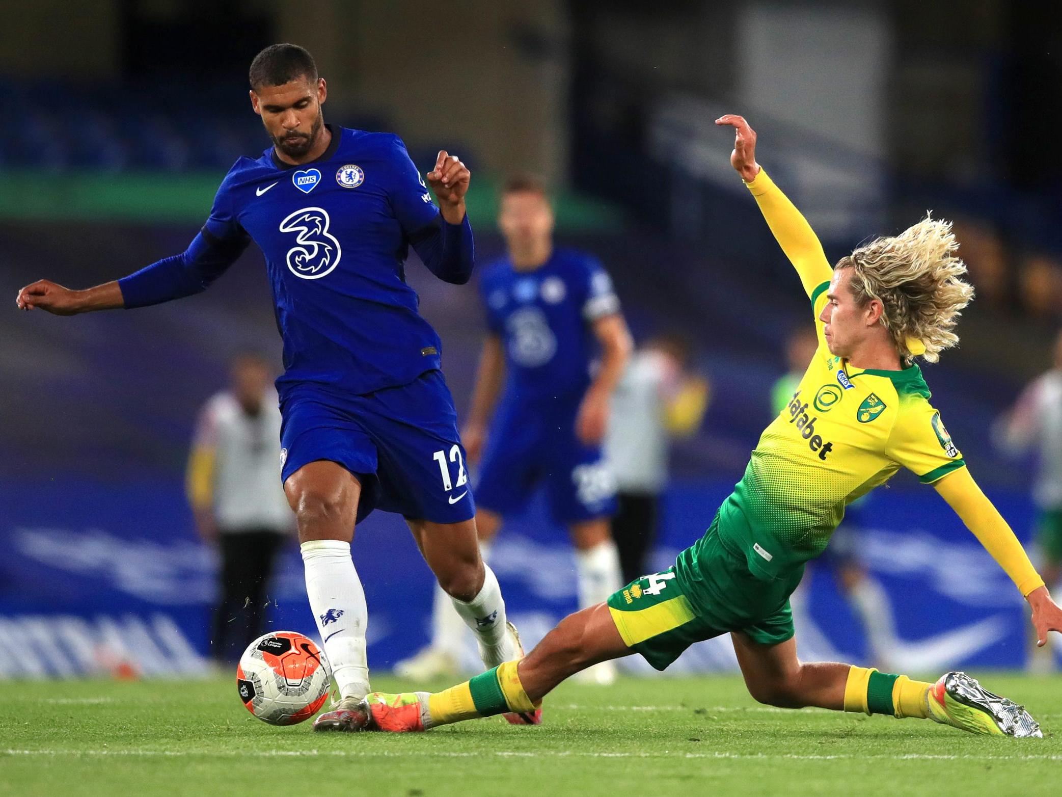 Todd Cantwell of Norwich City tackles Ruben Loftus-Cheek of Chelsea