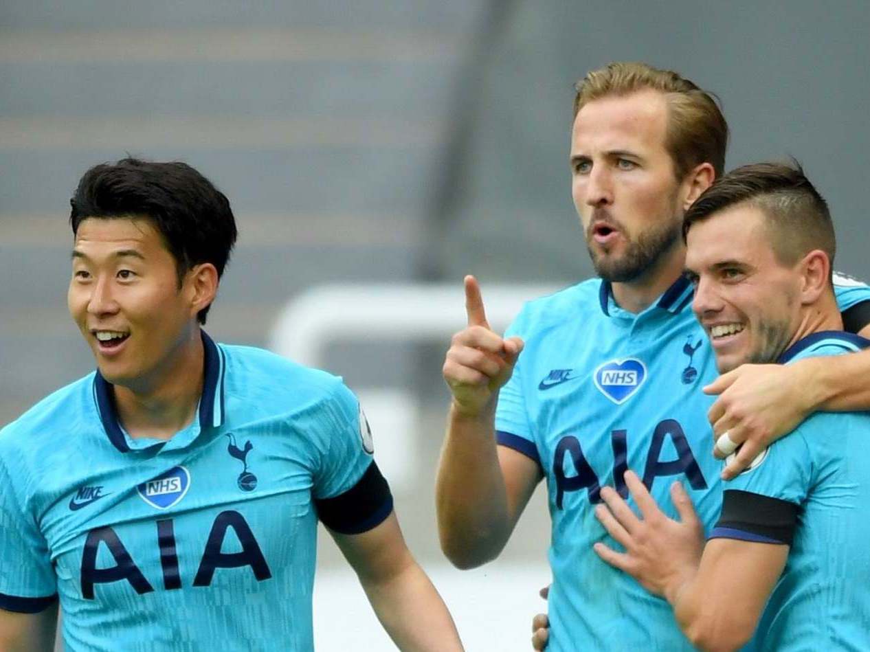 Harry Kane (centre) celebrates scoring with his Spurs team-mates