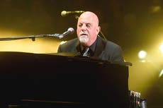 Billy Joel plays impromptu concert on discarded piano in New York street