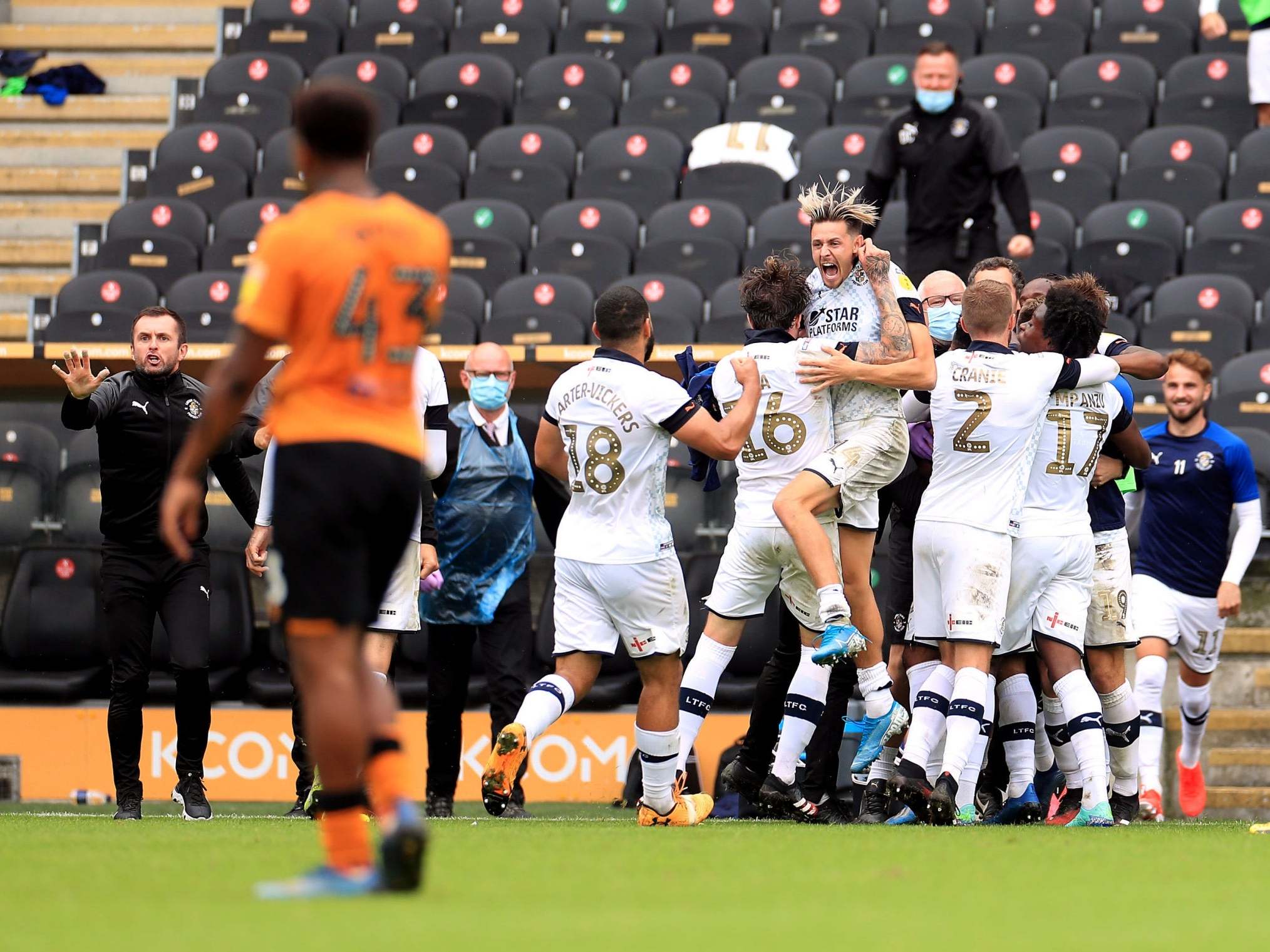 Luton celebrate their late winner by Kazenga LuaLua