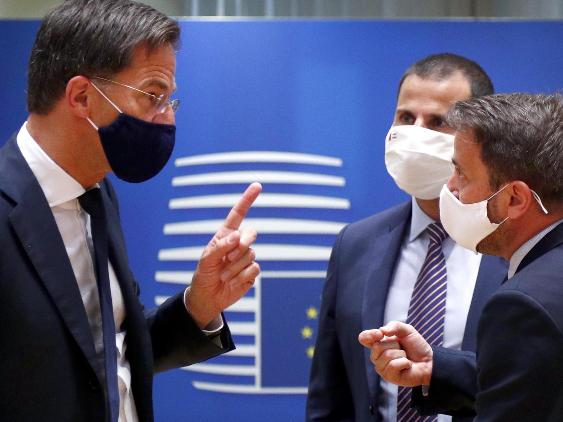 Dutch prime minister Mark Rutte (L) and Luxembourg's premier Xavier Bettel exchange words on Saturday