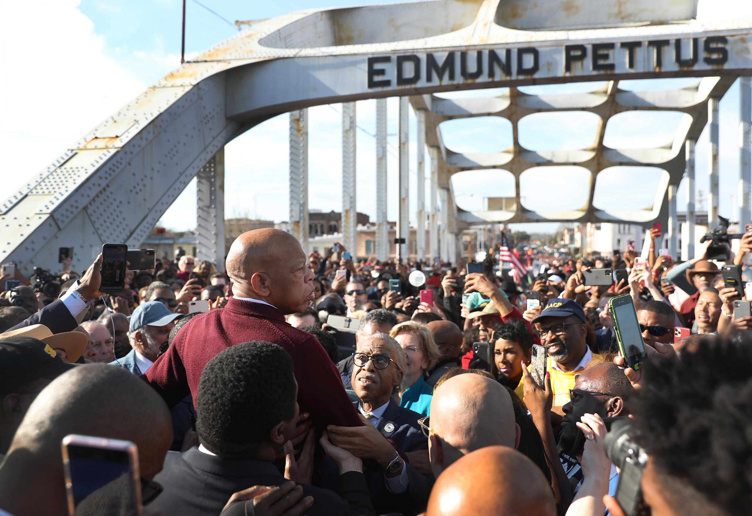 The civil rights leader speaks to the crowd at the Edmund Pettus Bridge crossing reenactment on 1 March this year