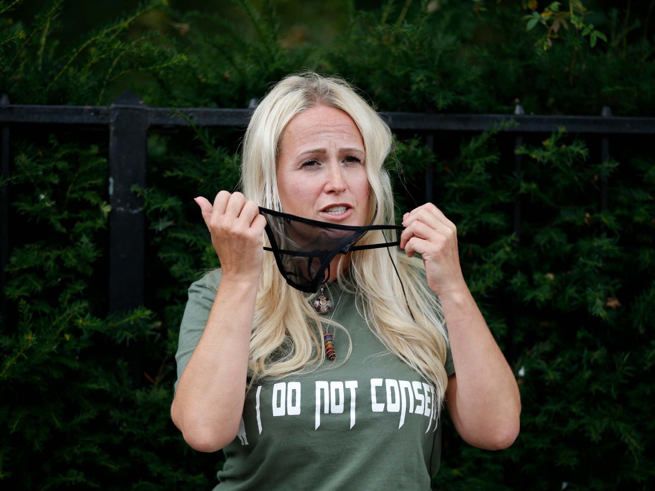 ‘Cassie Sunshine’ wears a g-string on her face as she speaks at the ‘Keep Britain Free’ protest