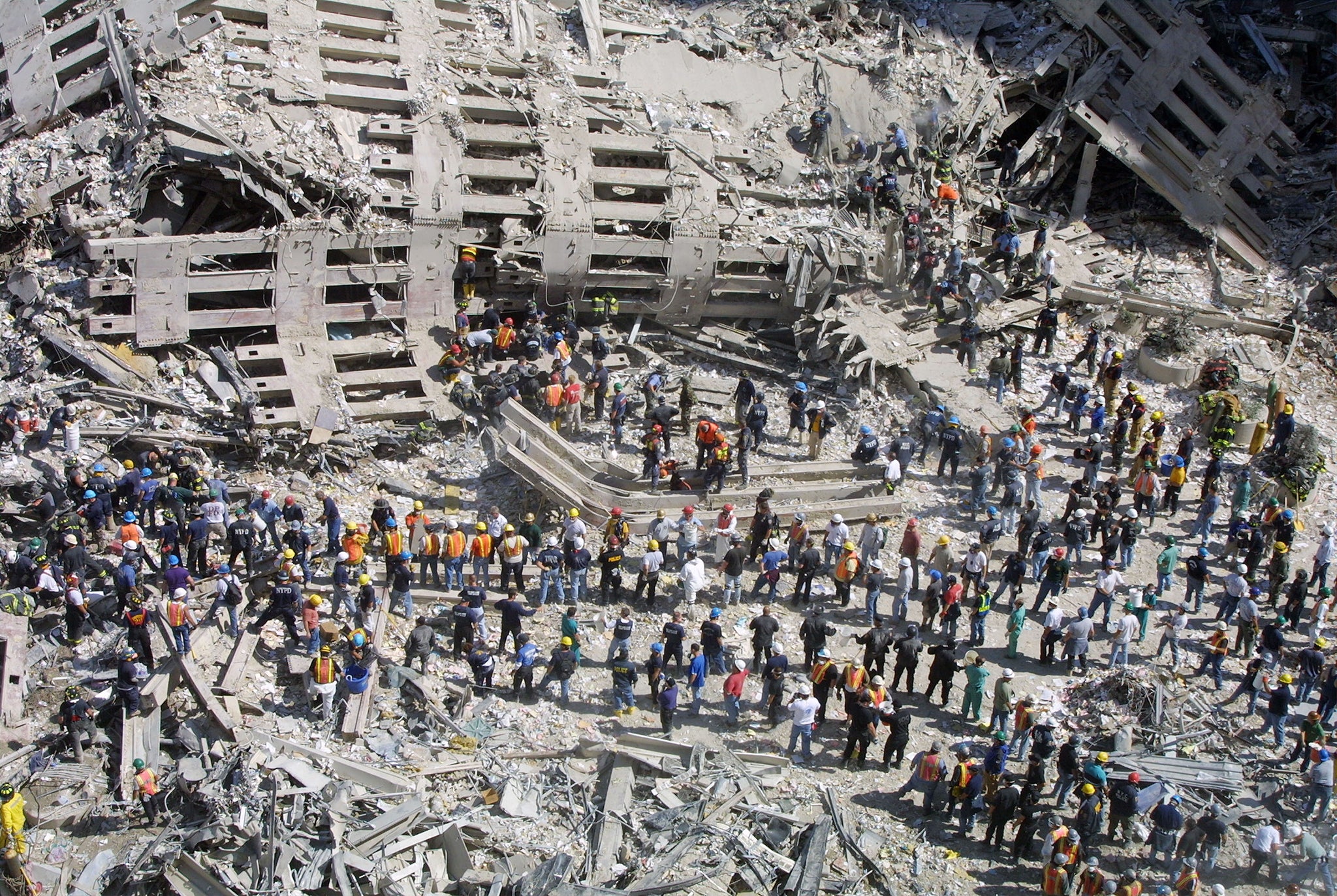 Rescue workers sift through the wreckage of the World Trade Centre, two days after two hijacked planes slammed into the twin towers