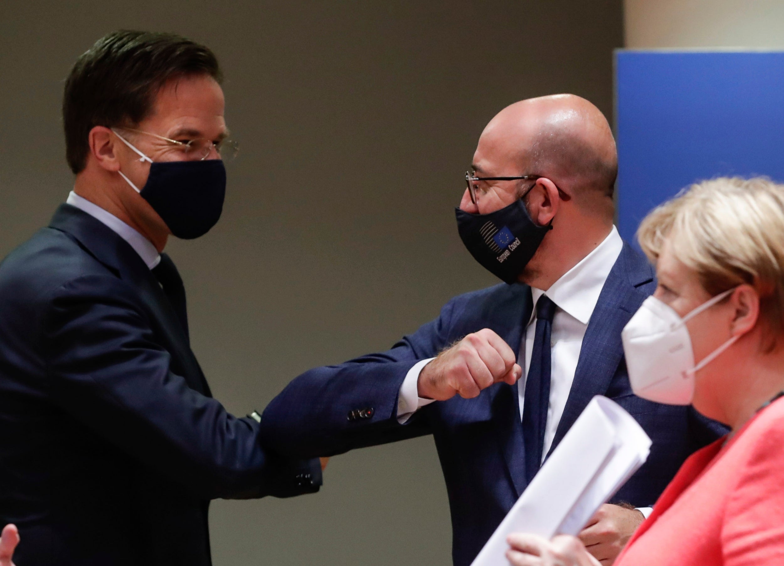 Dutch prime minister Mark Rutte (left) elbow bumps with European Council president Charles Michel as the talks drew to a close