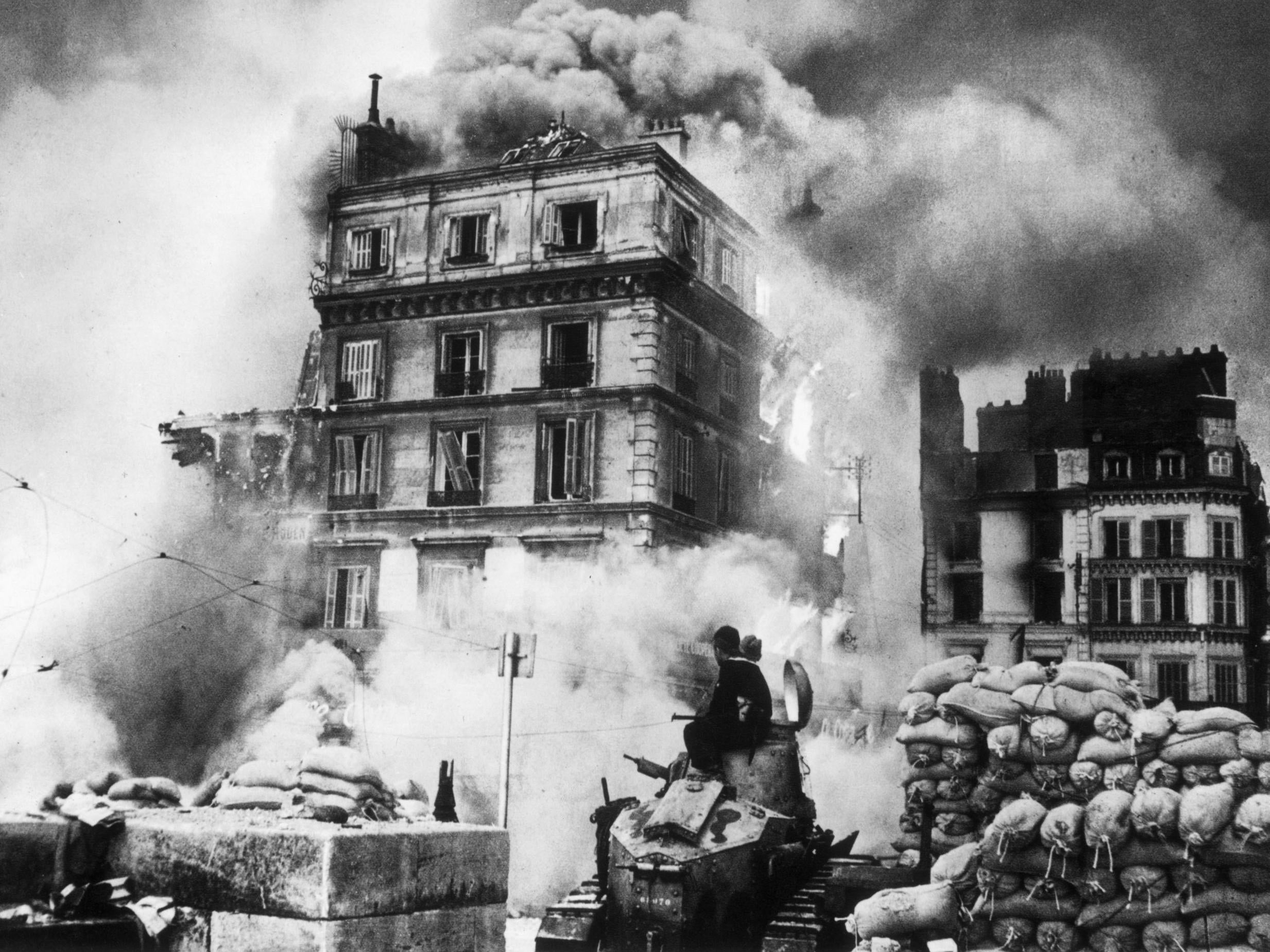 The French city of Rouen enveloped by smoke and fire during the German invasion in 1940