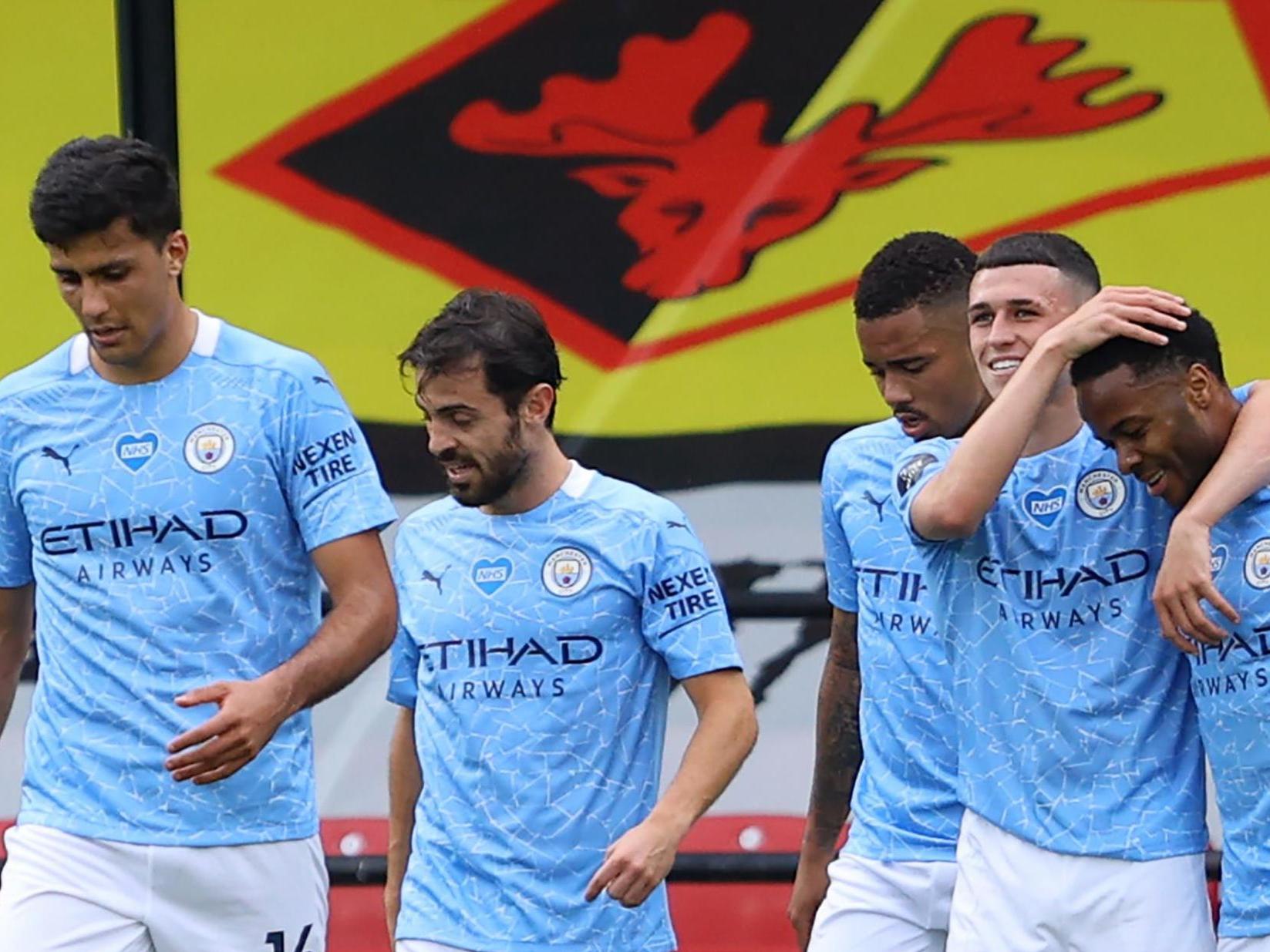 Foden celebrates with Raheem Sterling after scoring his second goal (Getty)