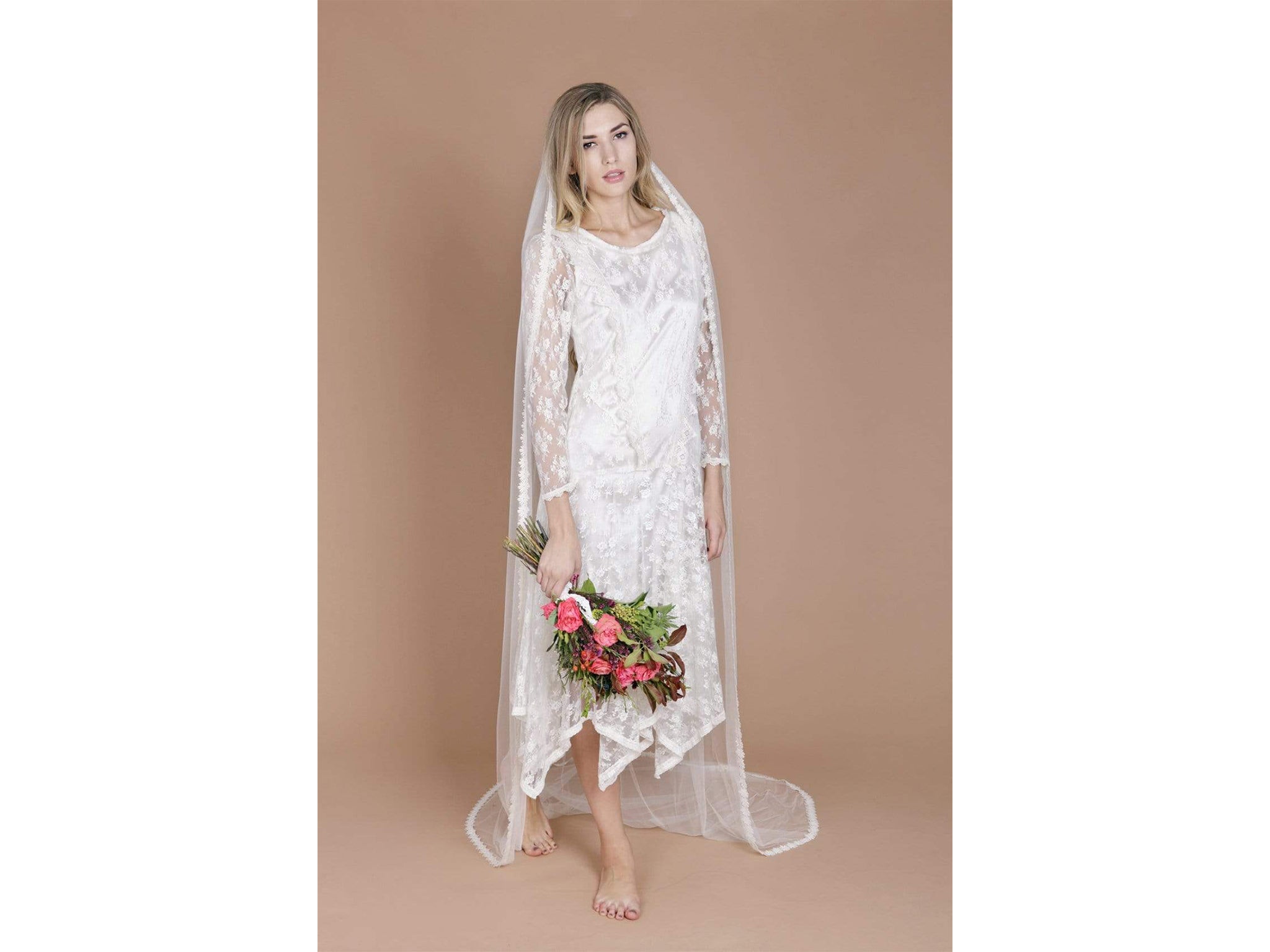 Made from silk tulle with a lace trim, this veil is the perfect finishing touch