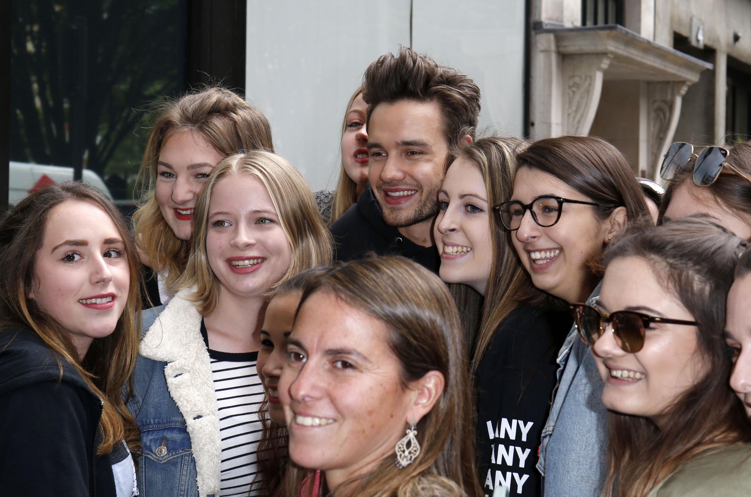 Liam Payne surrounded by fans in London, 2017