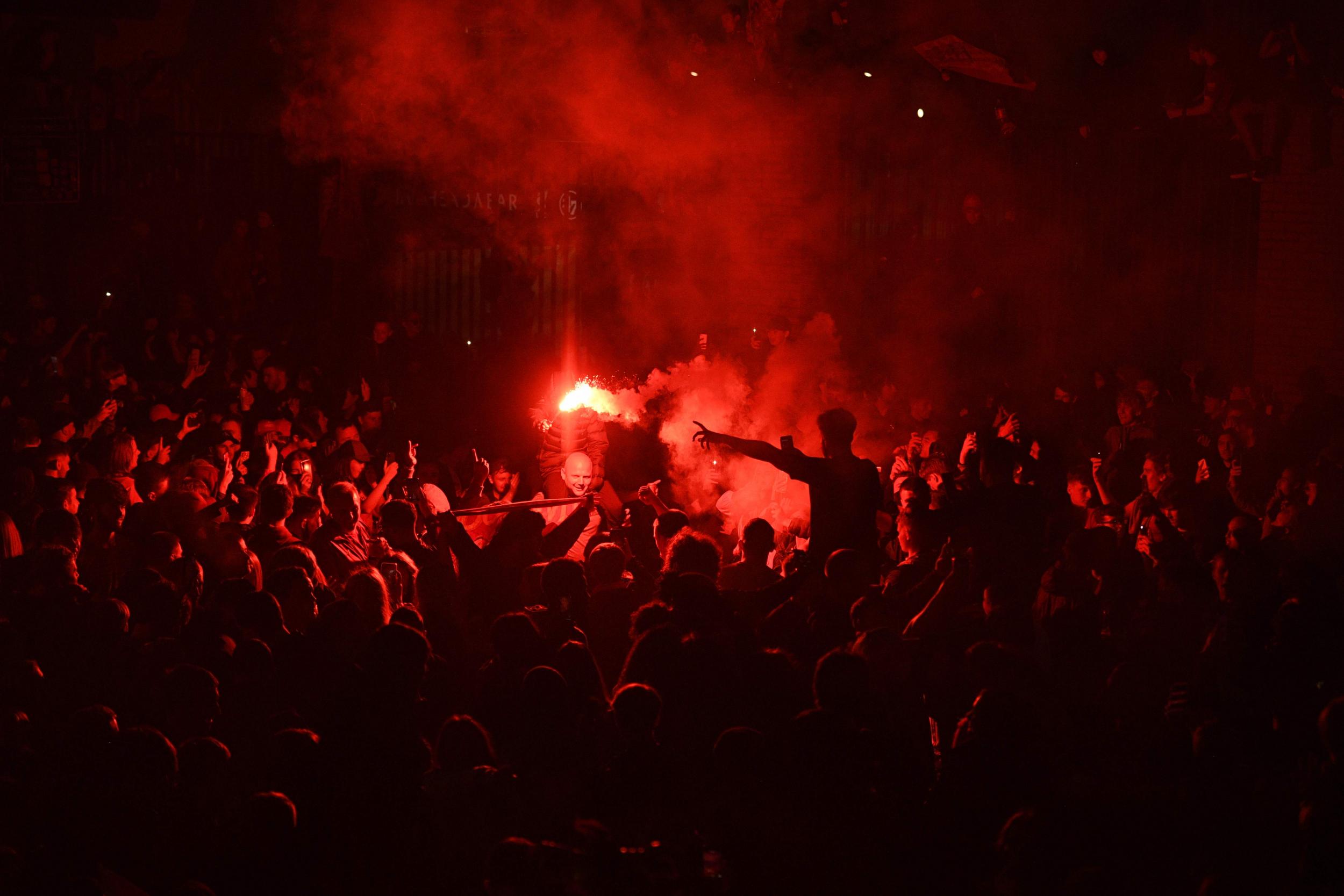 Liverpool fans defied police orders to celebrate outside Anfield