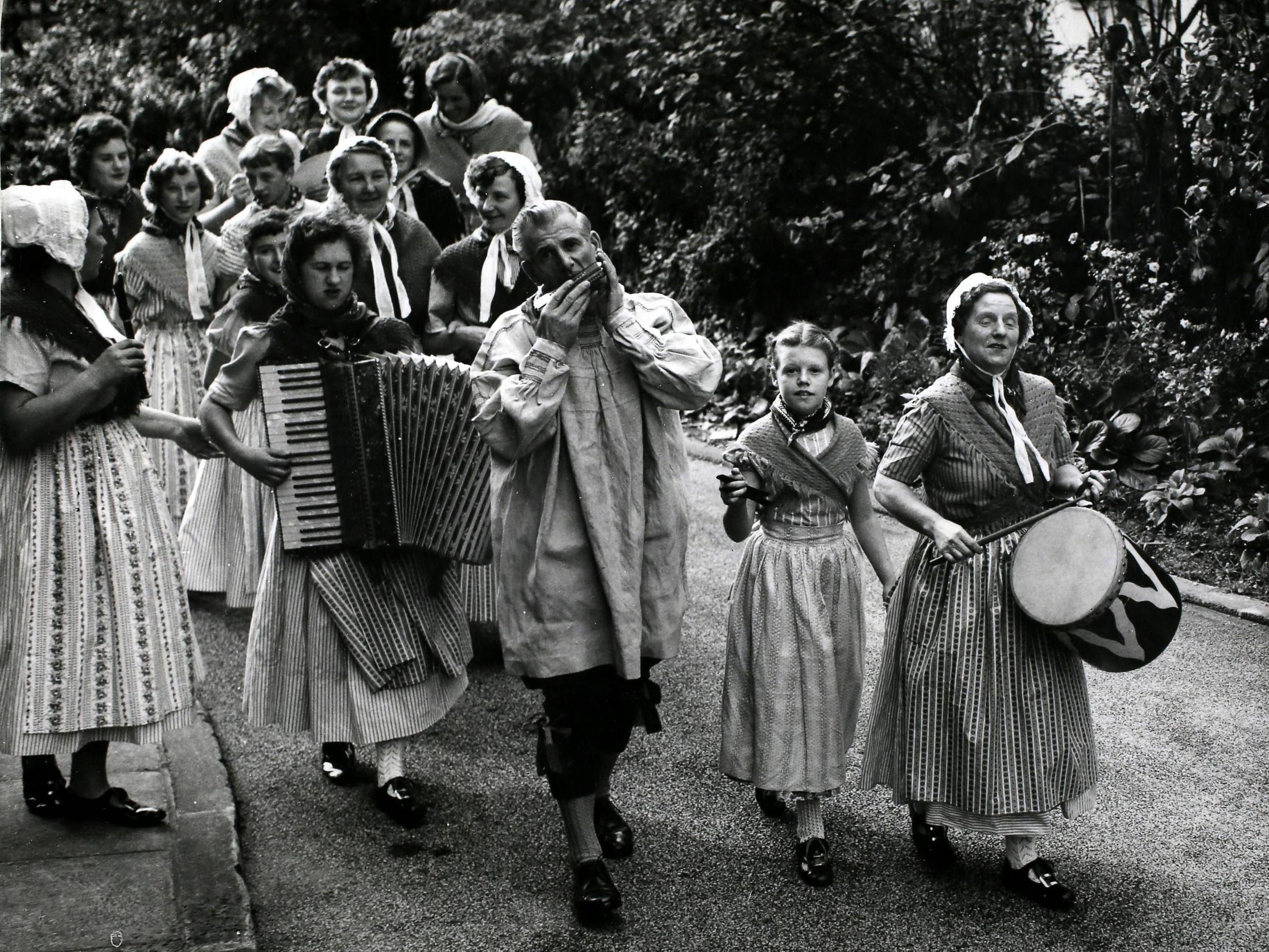 Competitors arrive for the diamond jubilee festival of the English Folk Dance and Song Society at CSH