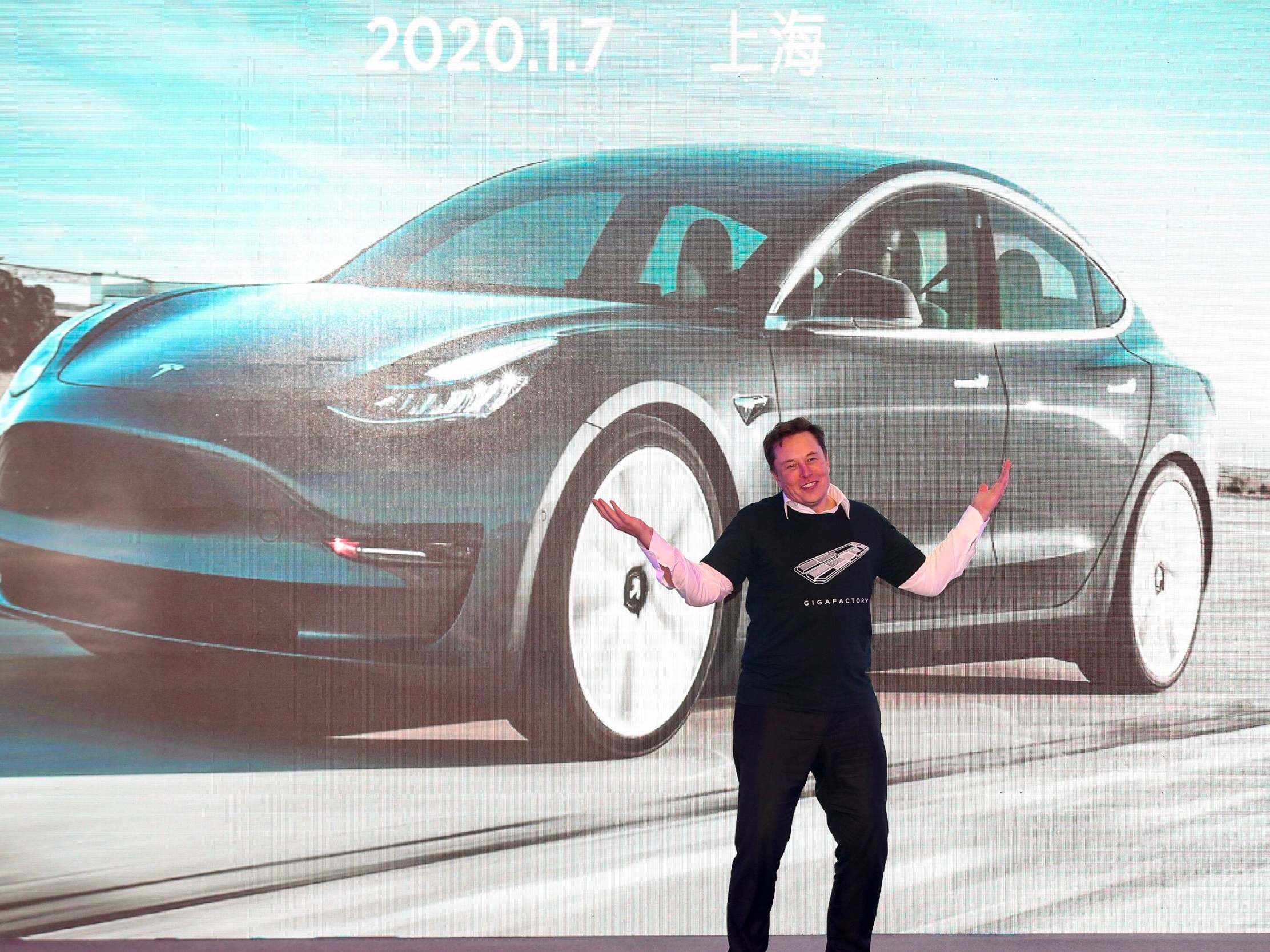 Tesla CEO Elon Musk gestures during the Tesla China-made Model 3 Delivery Ceremony in Shanghai