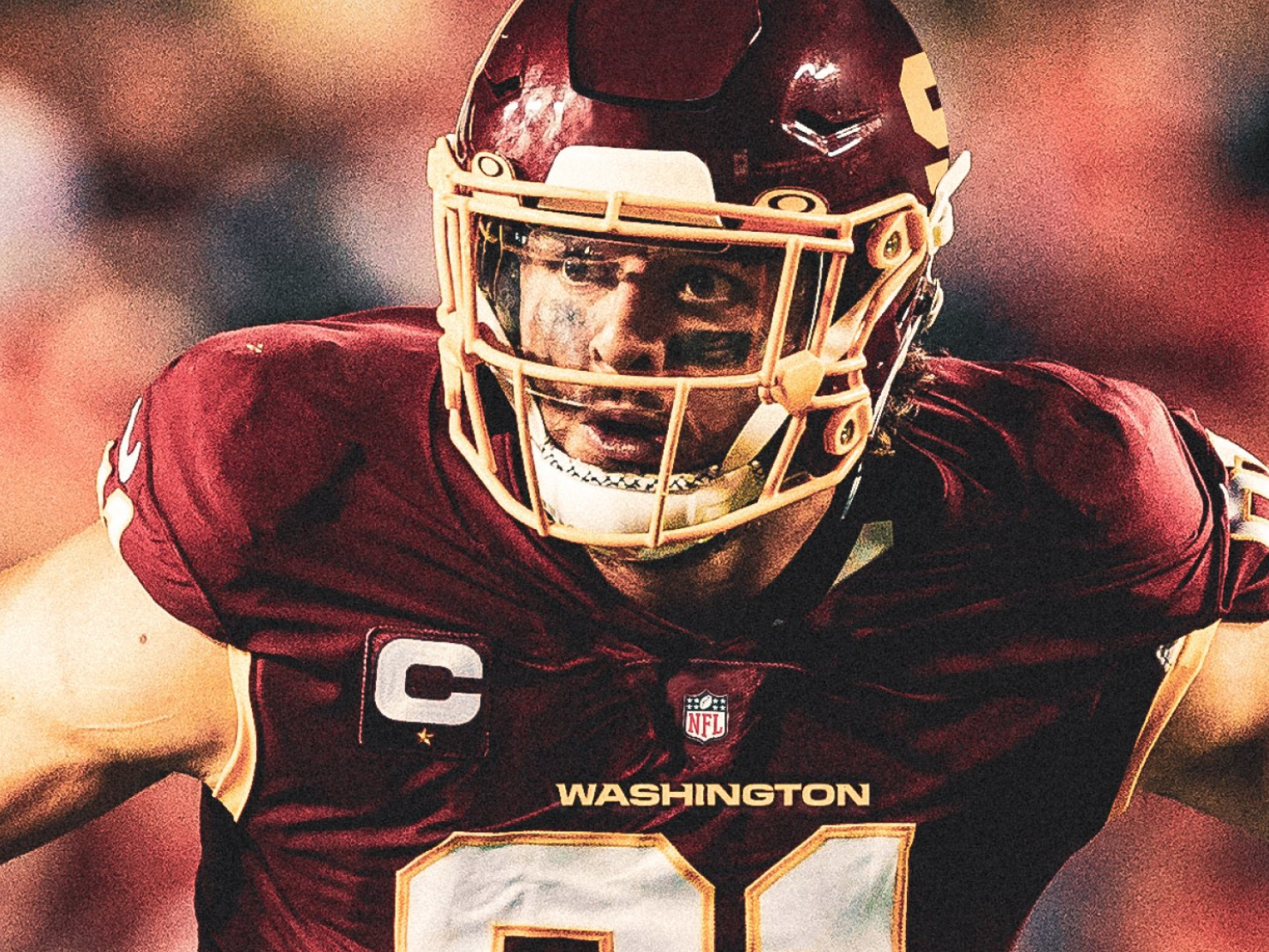 Ryan Kerrigan displays the new Washington Football Team uniform and helmet