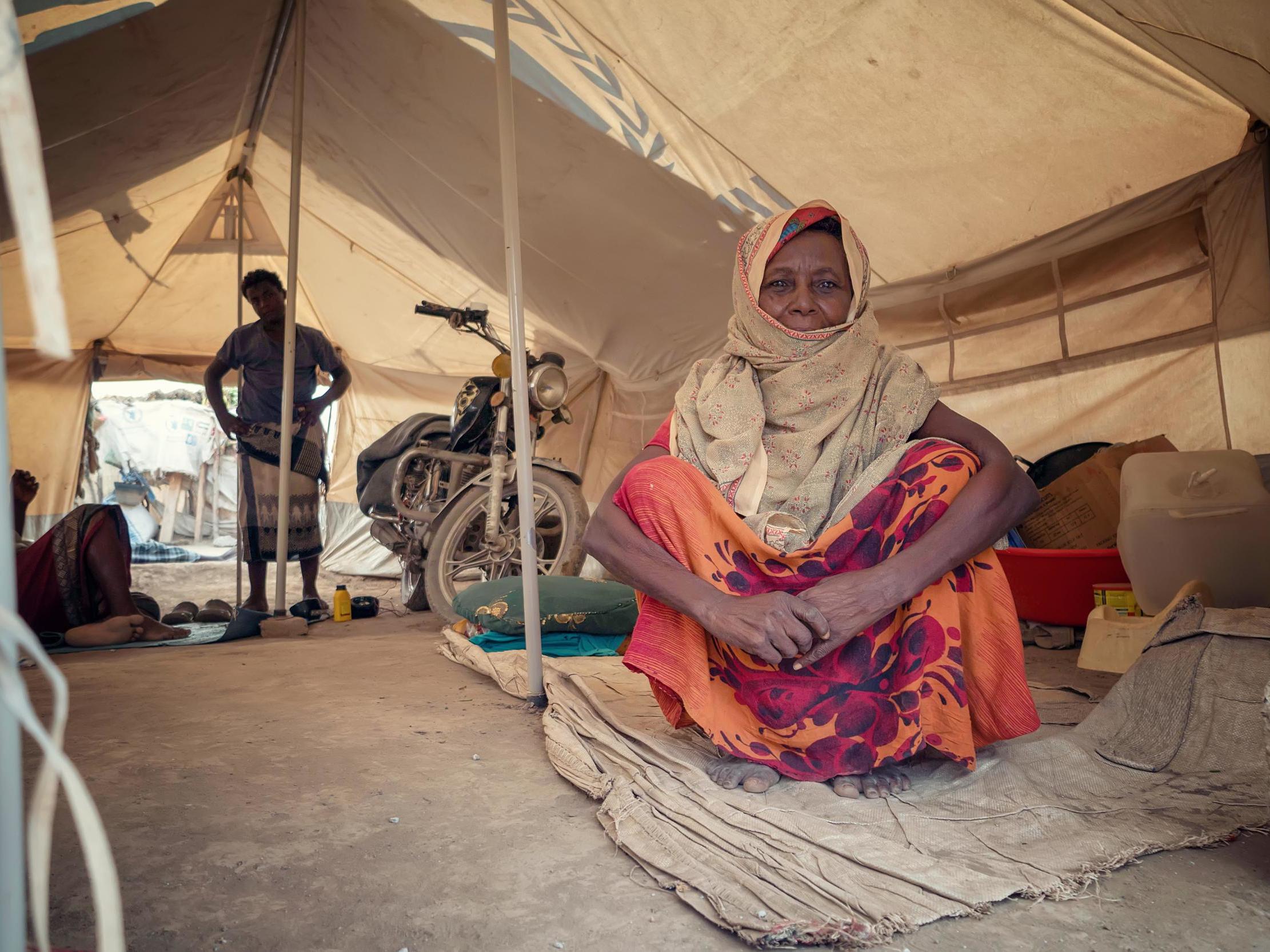 Sood Ahmed, 80, sitting inside her tent in an IDP camp near Aden. She fled the war with her family when it reached their homeland in Al-Hodeida governorate. She has been living in the camp for more than two years now